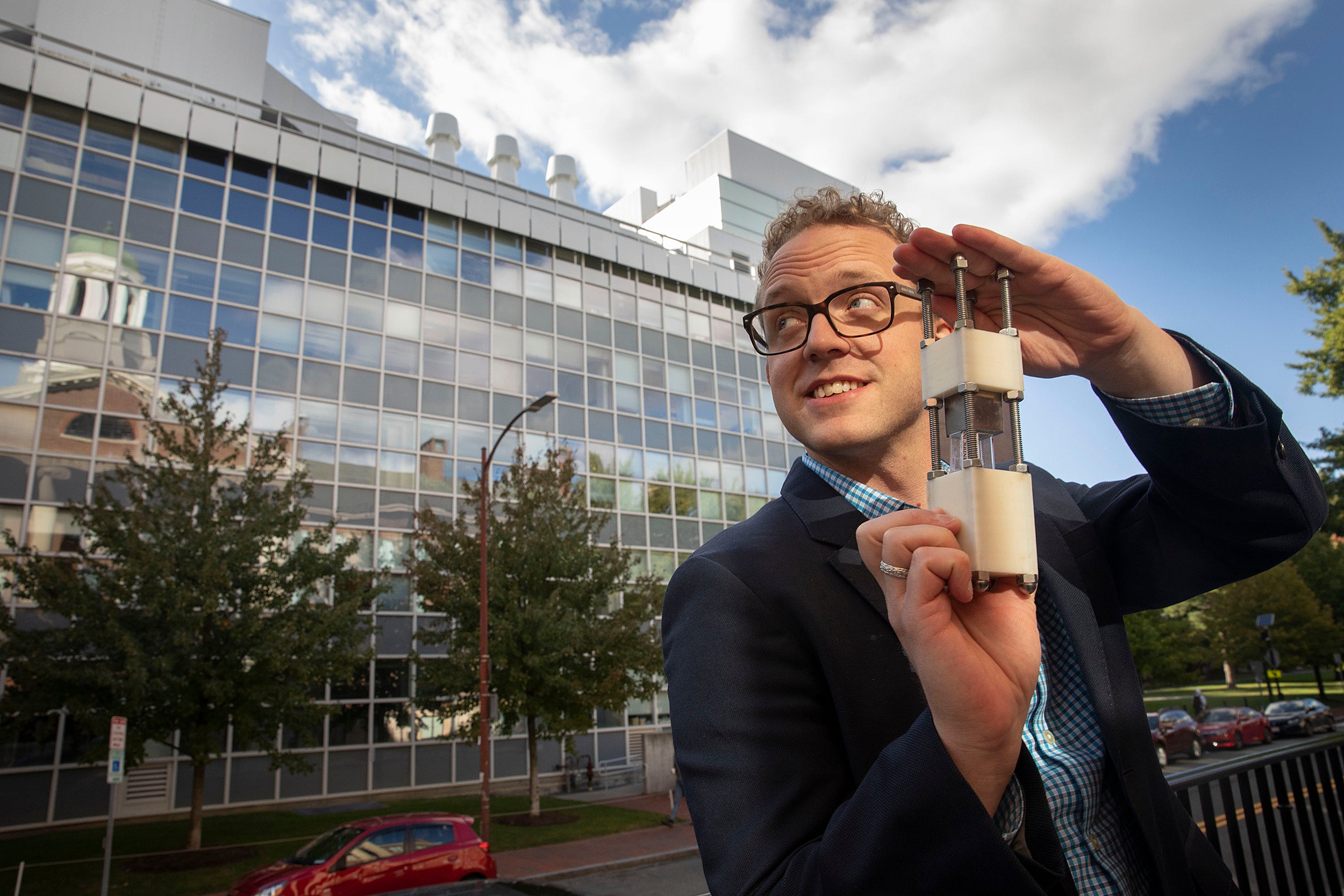 Christoffer Abrahamsson holding a small device