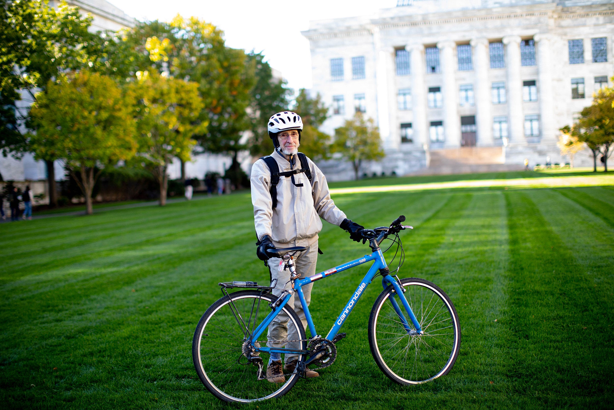 Jonathan Beckwith stands alongside his bicycle at Harvard Medical School.