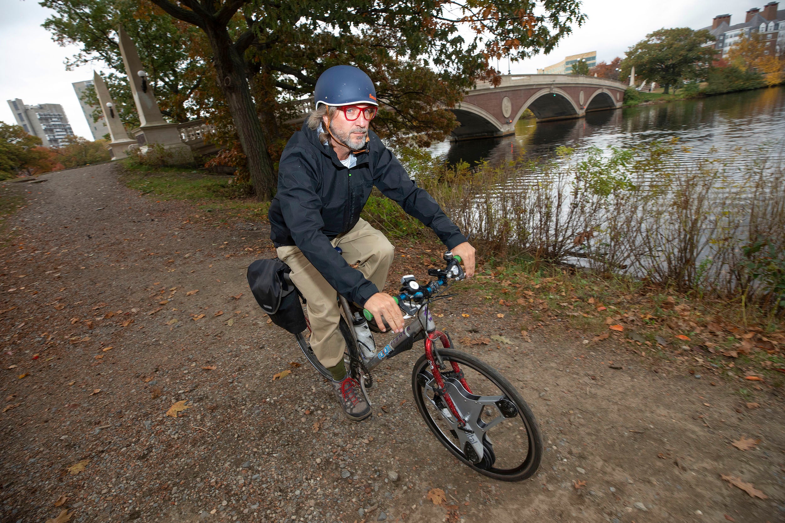 Lance Schumacher rides his e-bike near the Weeks Bridge.