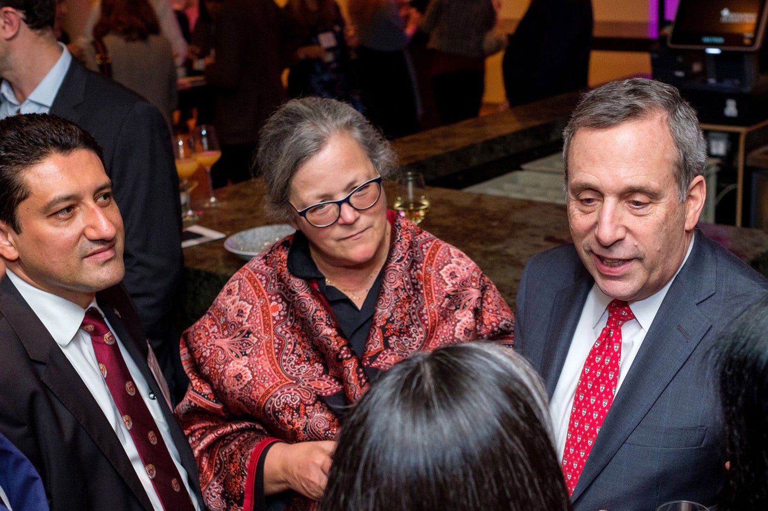 Victor Moscoso, Alice Hill, and Larry Bacow chat with conference-goers
