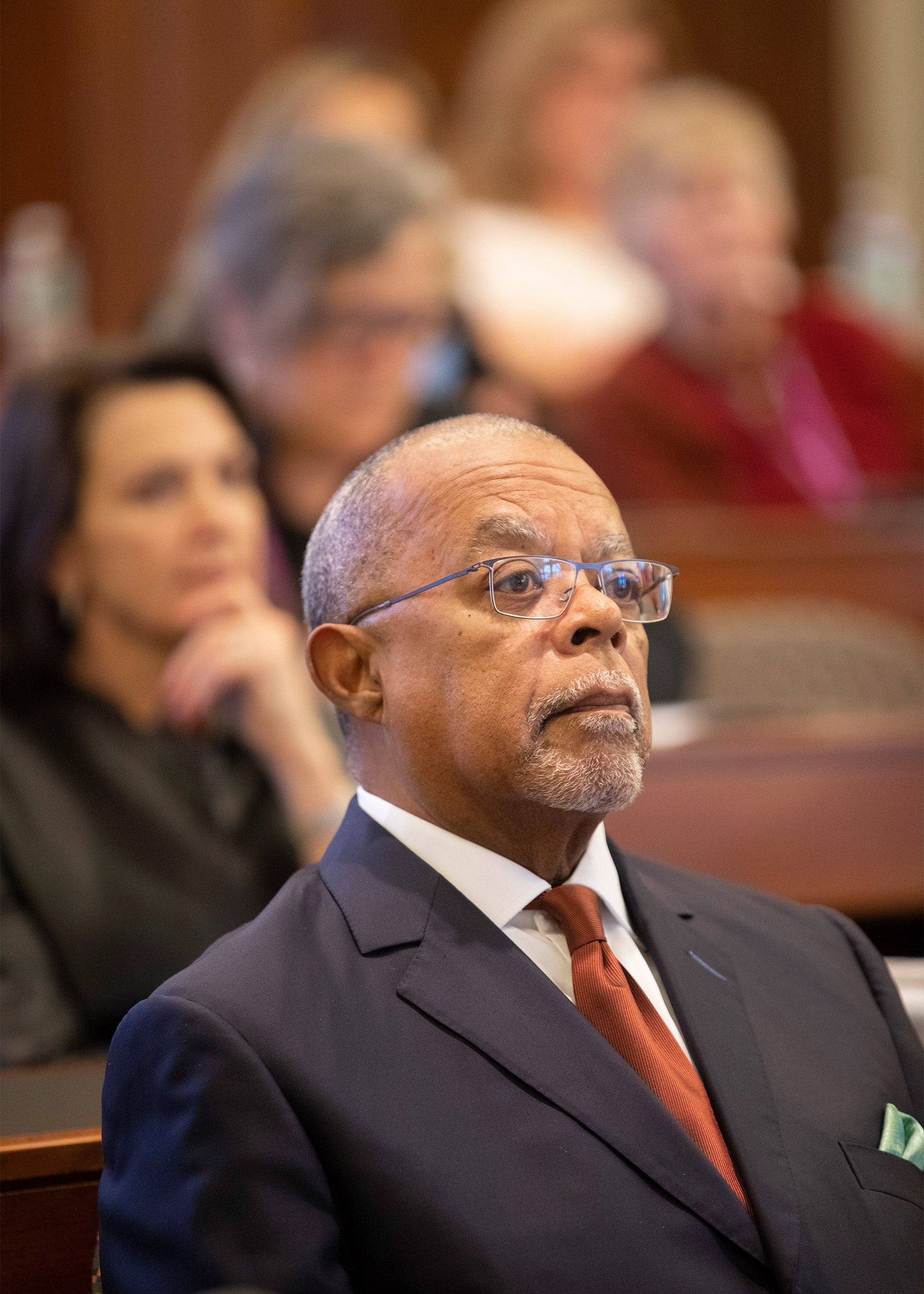 Henry Louis Gates Jr. sitting among people in audience.