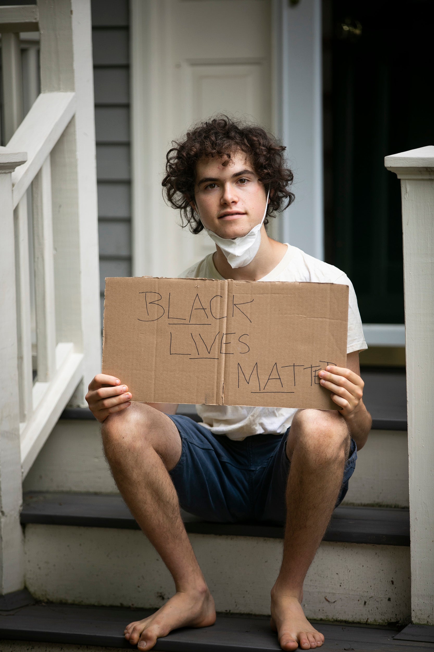 Jeremy Ornstein holds Black Lives Matter sign.