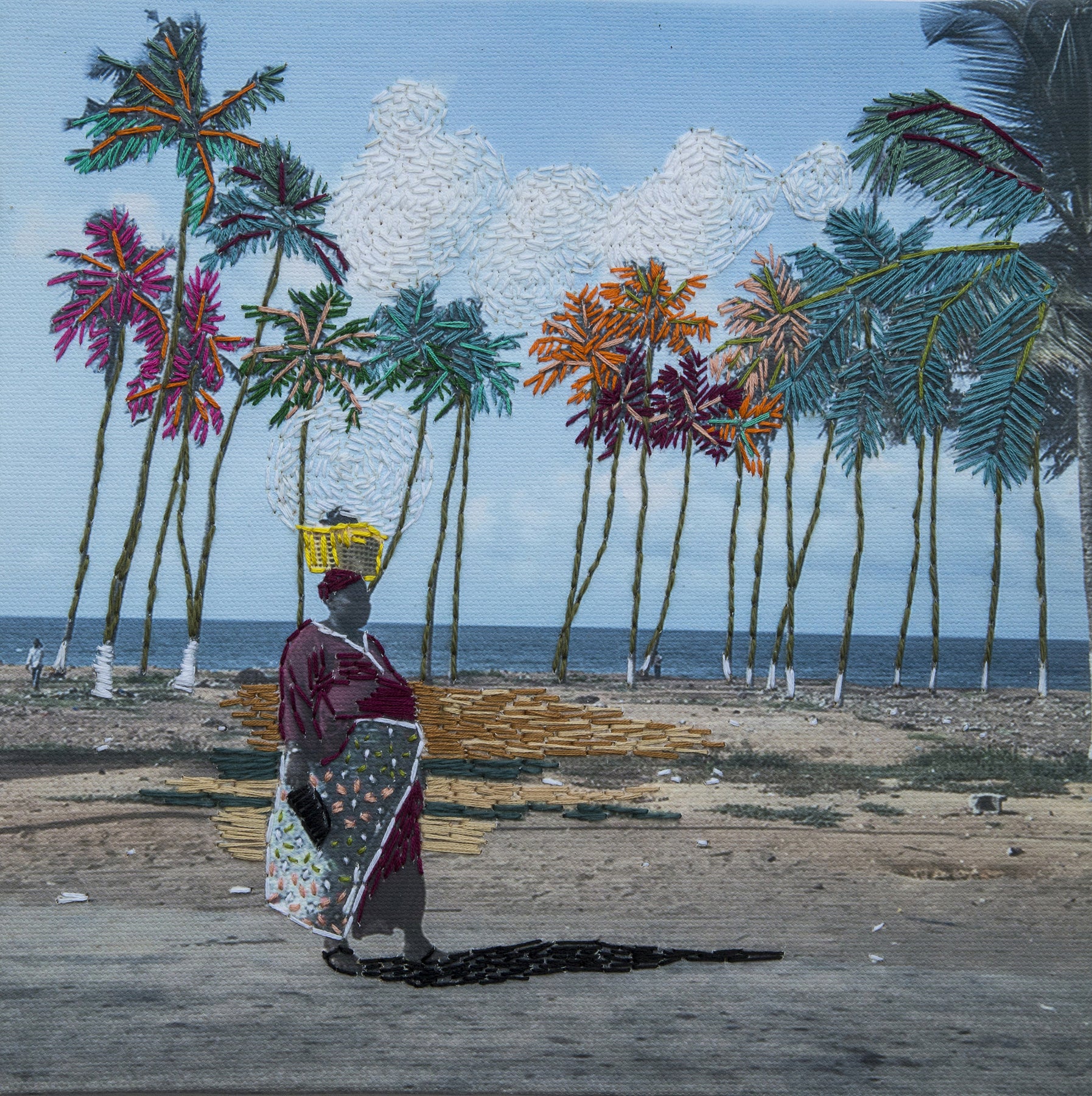 Embroidered photograph of woman walking by palm trees.