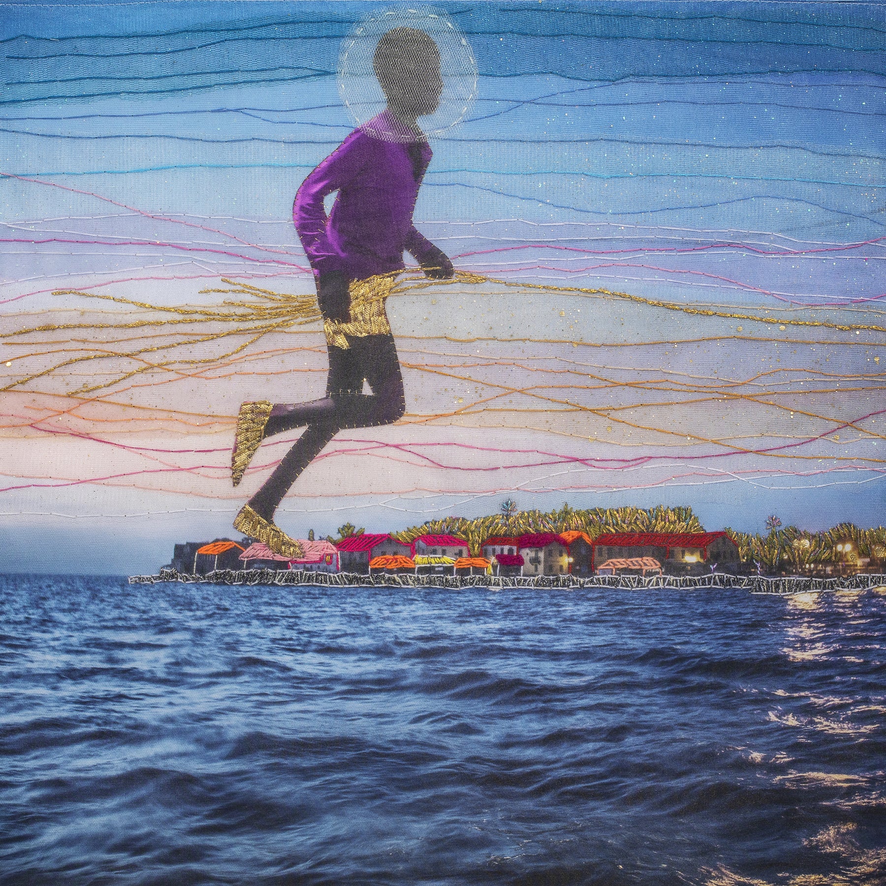 Embroidered photograph of boy floating over coastline.