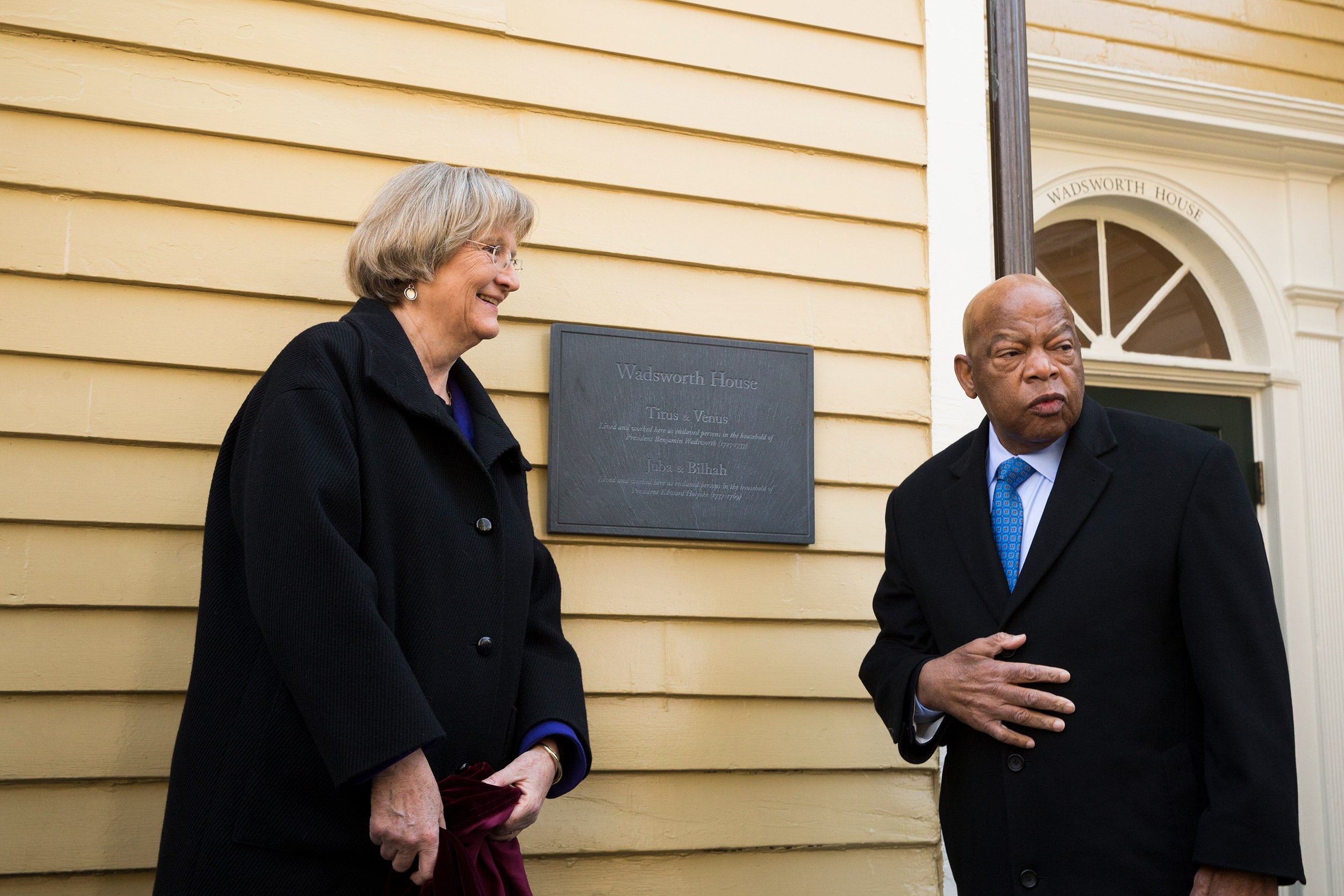 Harvard President Drew Faust and Congressman John Lewis unveil a plaque that recognizes four slaves who worked at Wadsworth House.