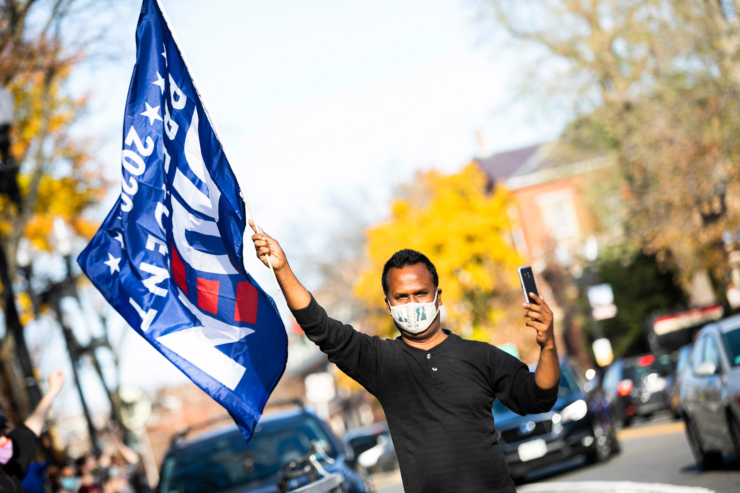 Man holds Biden flag.