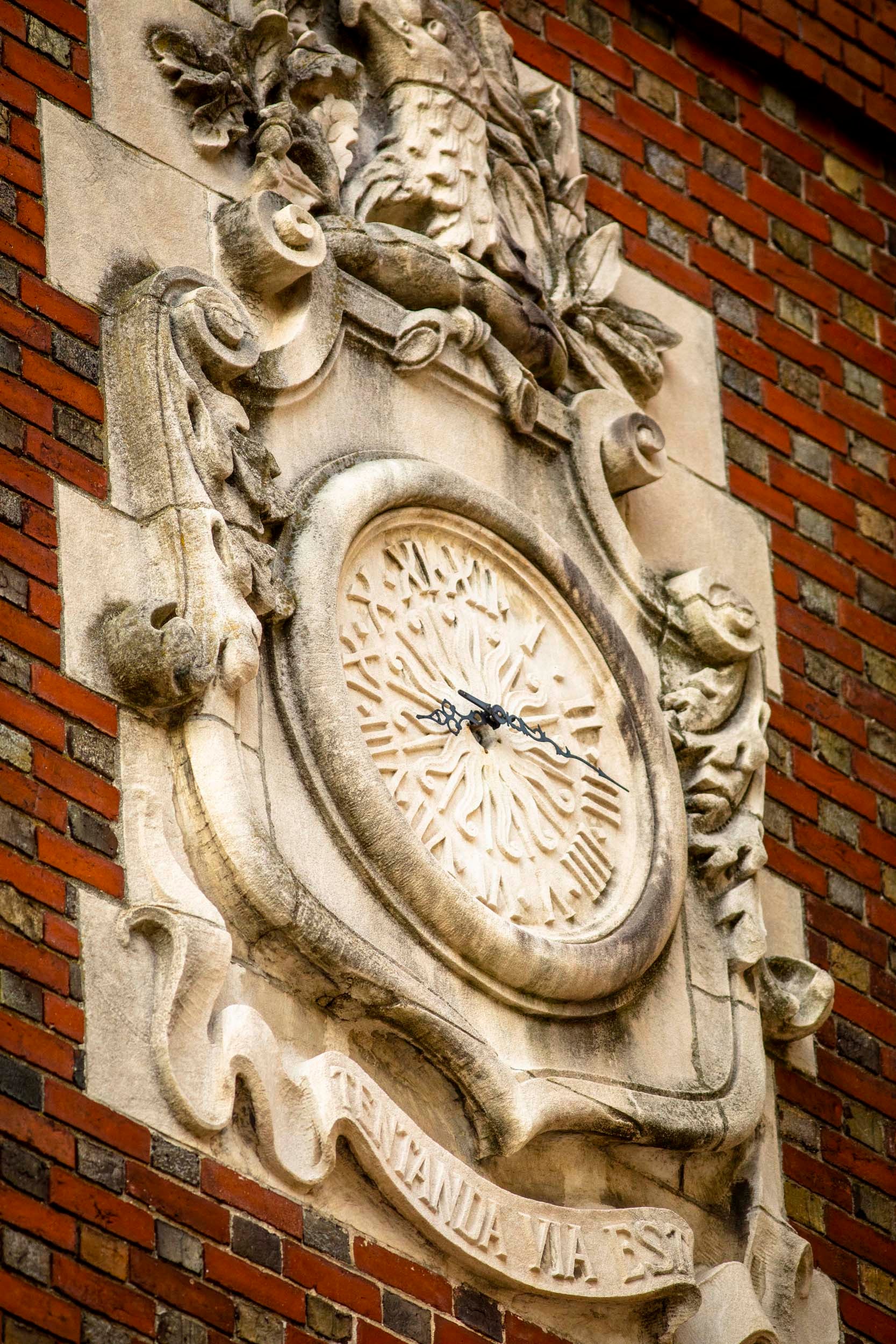 An elaborate clock is pictured on Adams House.