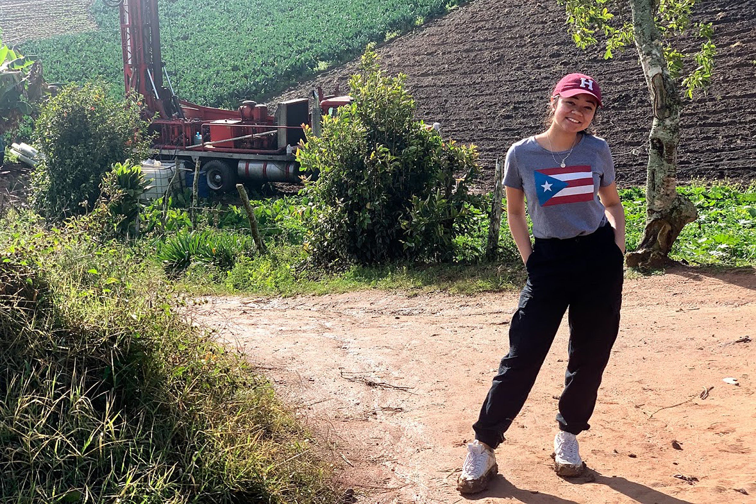 Daniela Villafuerte stands near drilling equipment.