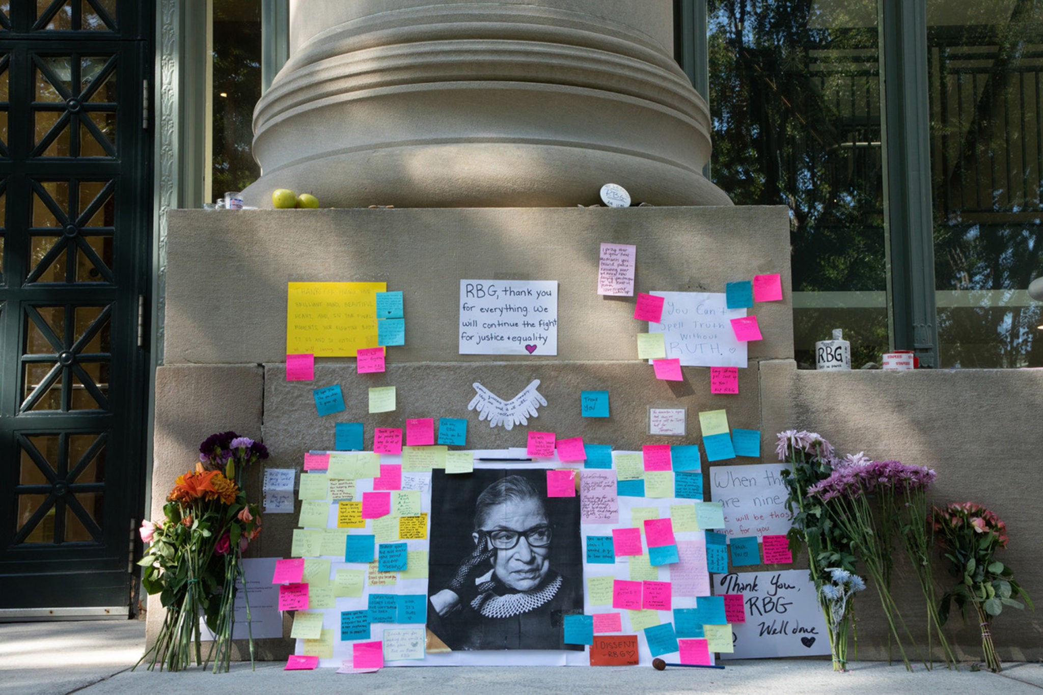 A memorial to Ruth Bader Ginsberg on the steps of an HLS building.