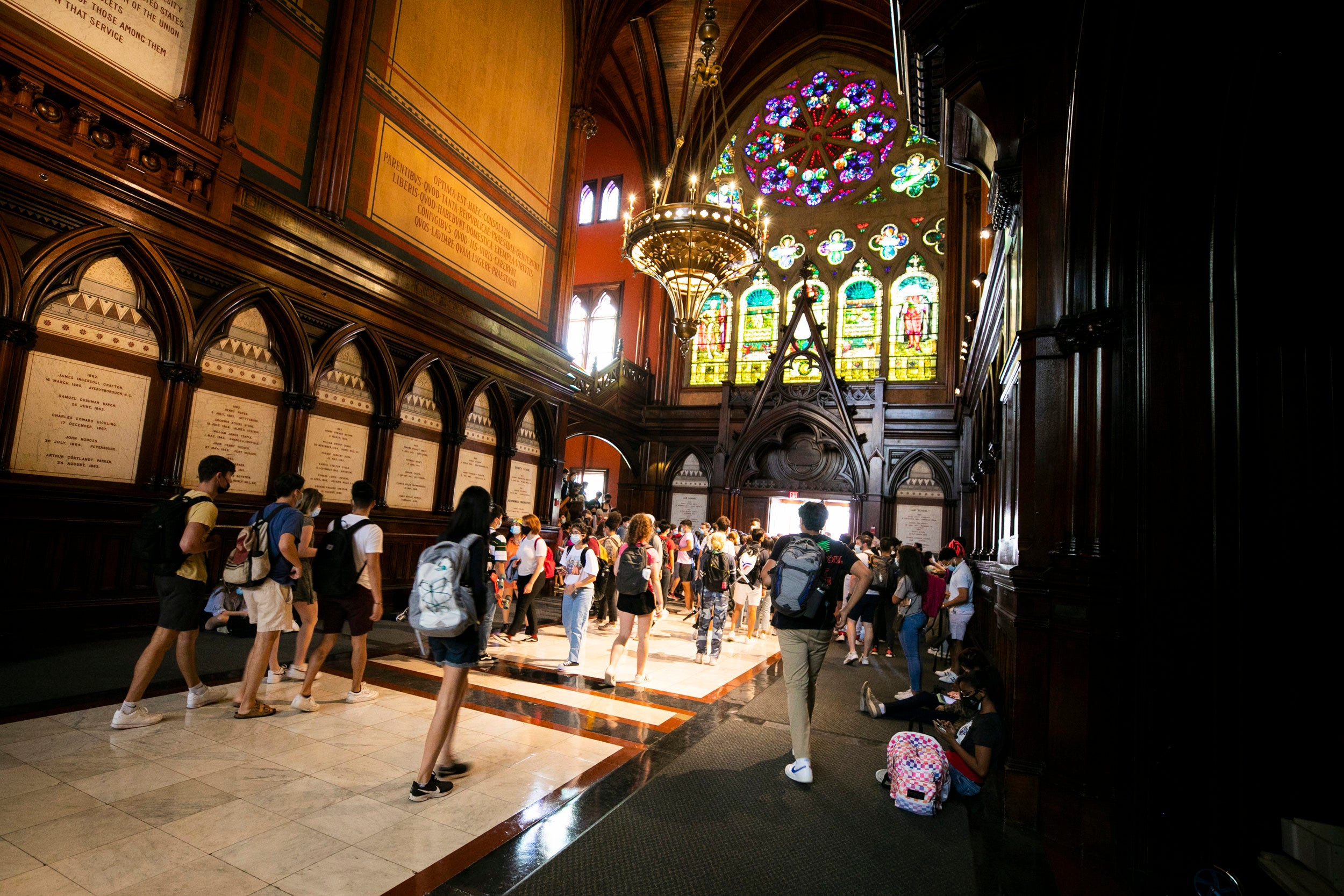 Students gather in the transept before heading into the lecture.