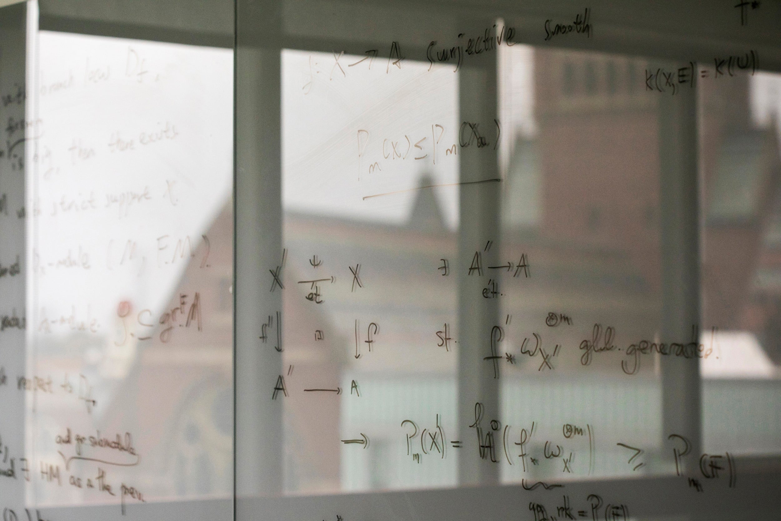 Campus reflected in glass whiteboard.