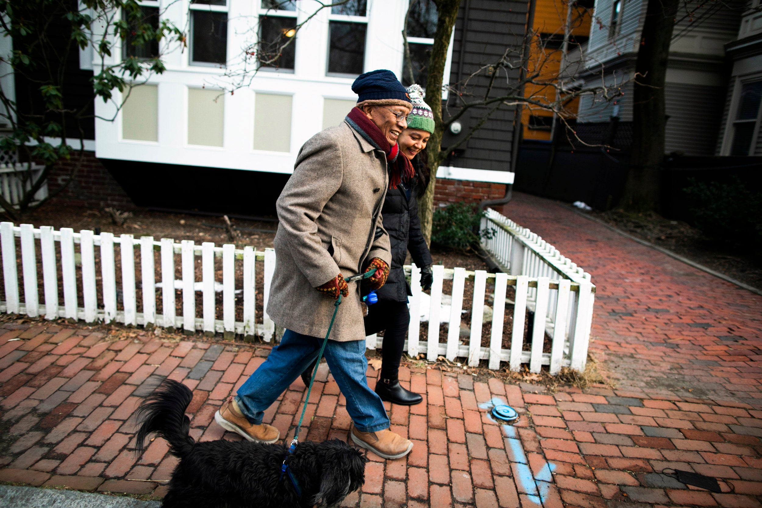 Orlando Patterson and wife Anita Goldman walk dog.
