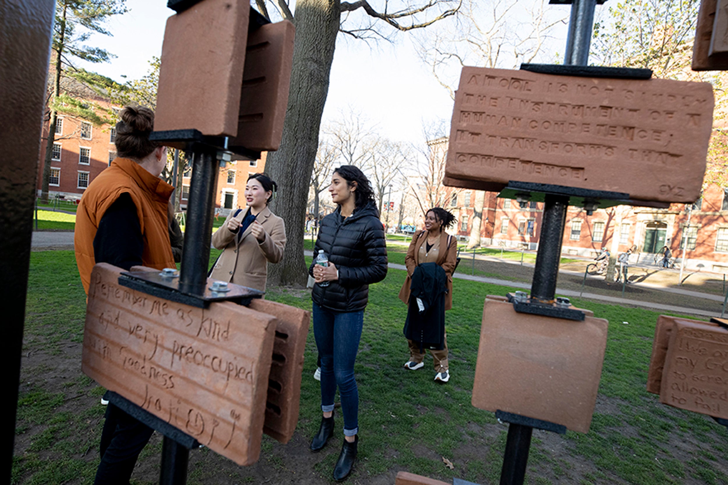 Cecilia Zhou, Kiana Rawji, Tracy K. Smith tour "Inclusions" installation in Harvard Yard.