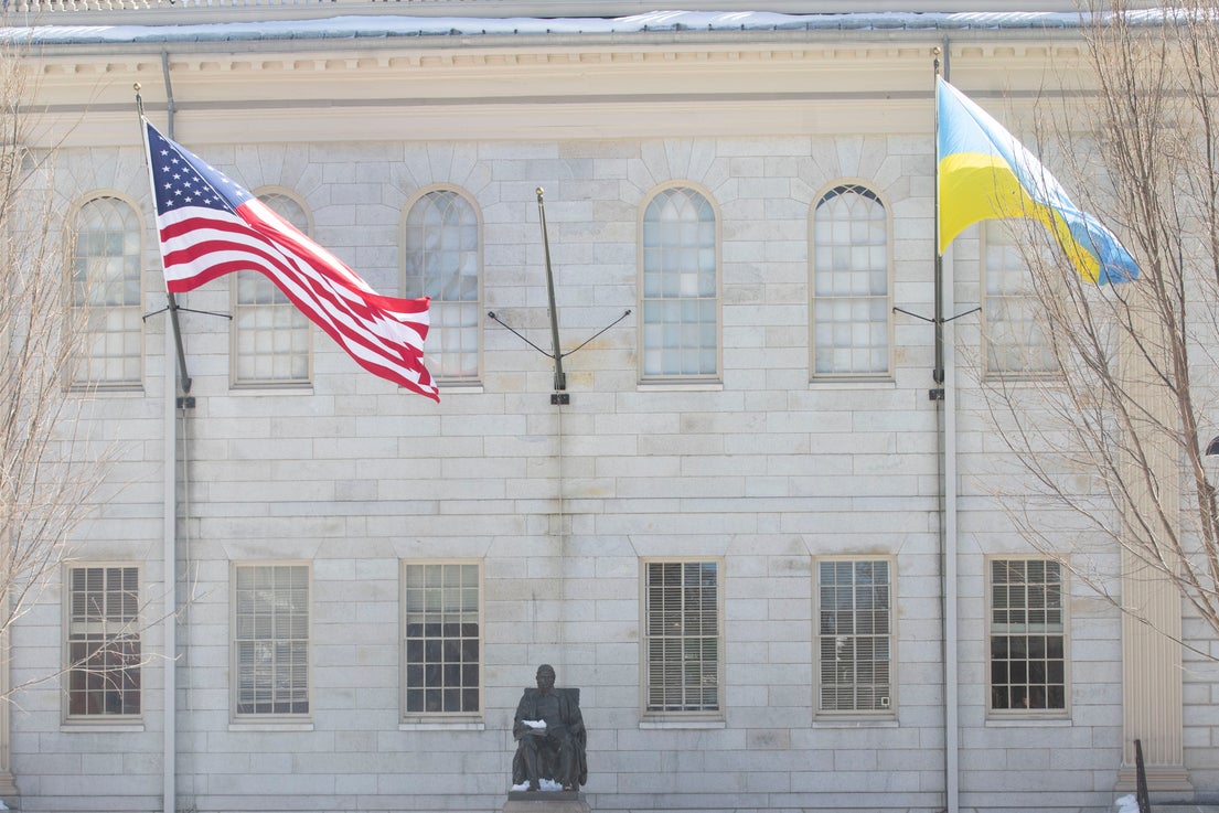 The American flag and the Ukrainian flag flying in Harvard Yard