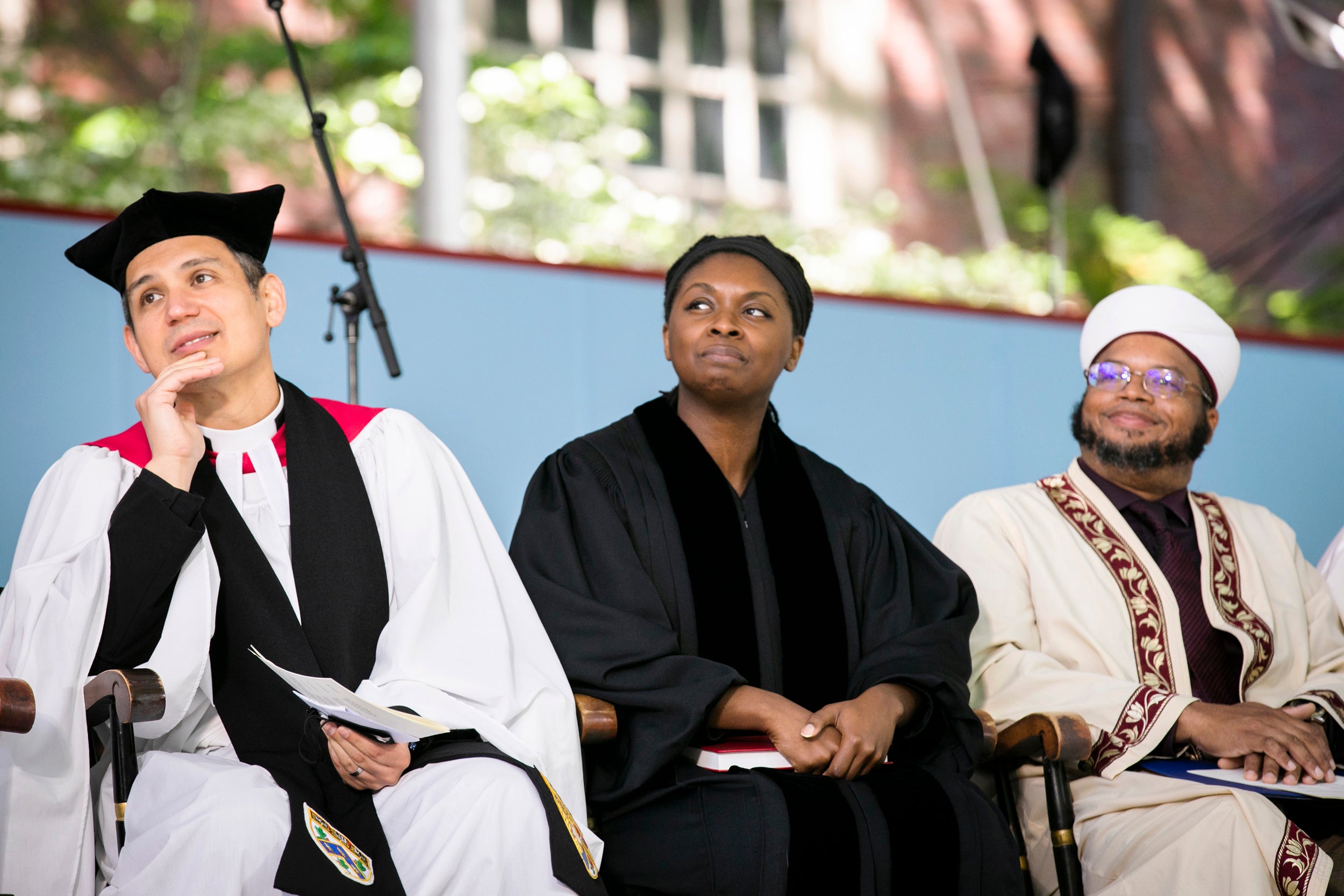 Pusey Minister Matthew Potts (from left), Dr. Mia Chandler, and Imam Dr. Khalil Abdur-Rashid listen during the Baccalaureate Service.