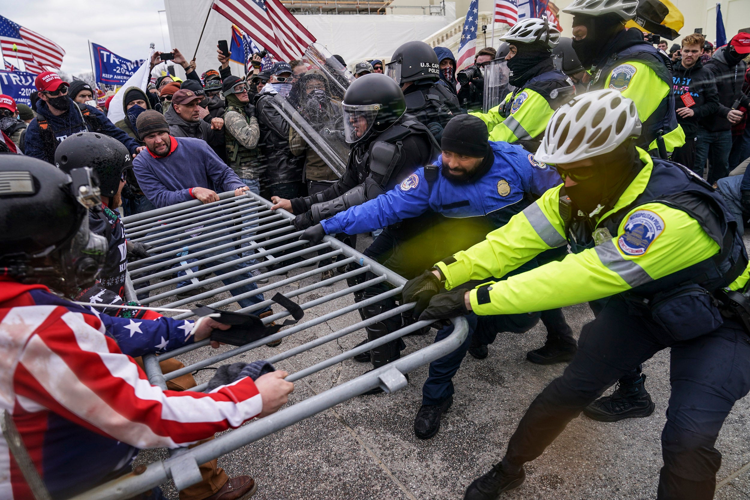 People try to break through barrier at Capitol on Jan. 6, 2021.