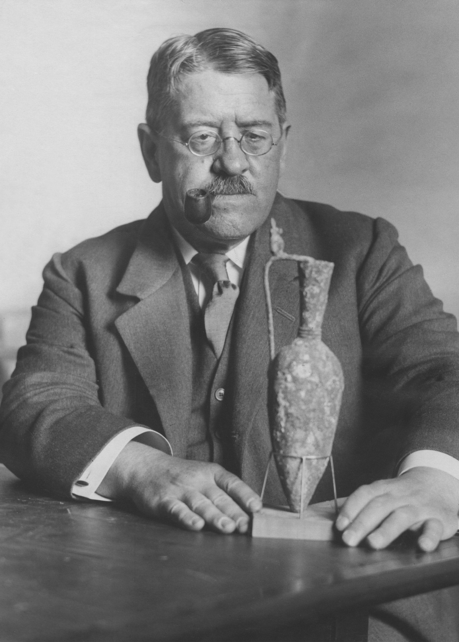 George Reisner with a bronze vase from a 1923 excavation.