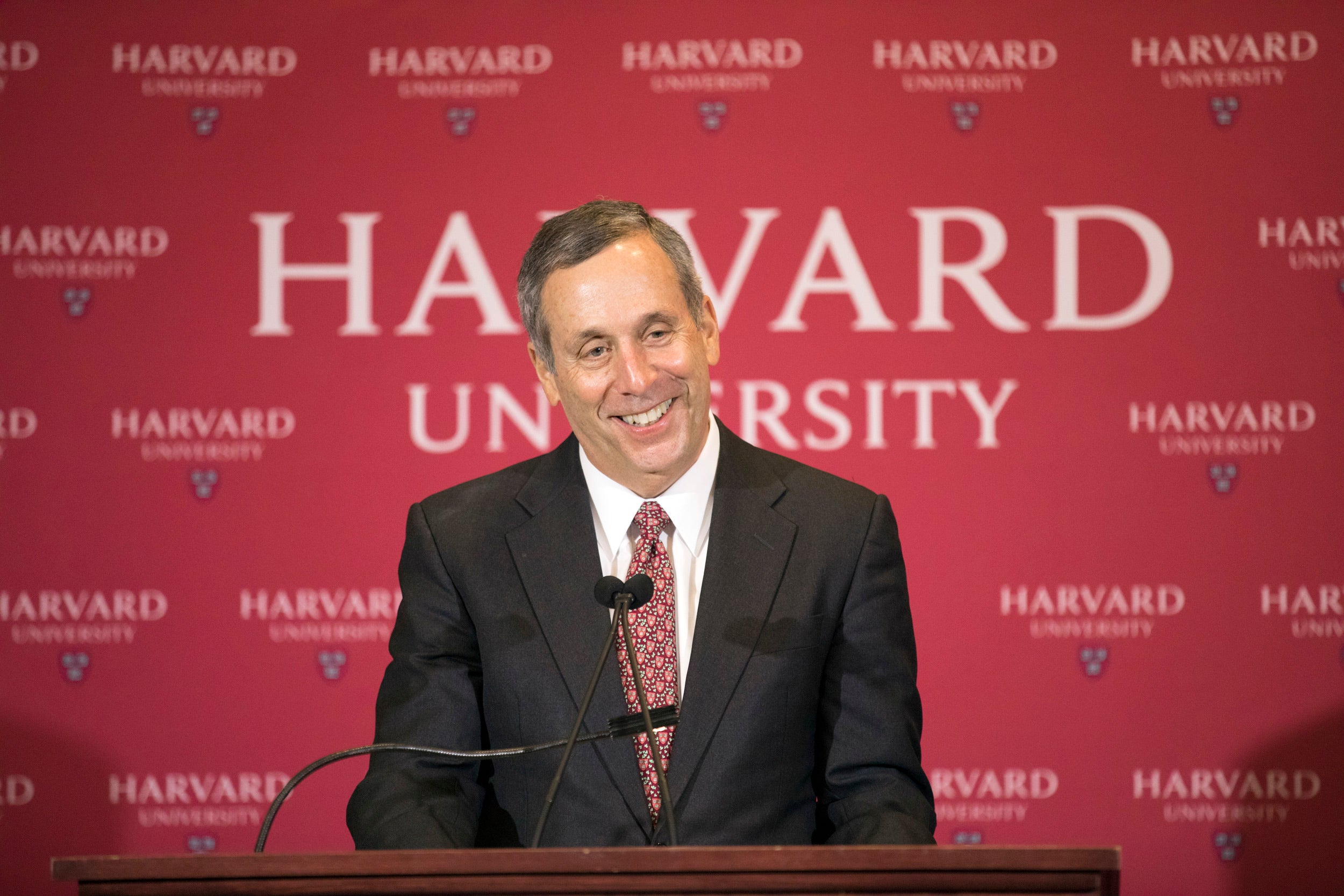 Larry Bacow is pictured at the podium in February 2018 after his selection as Harvard’s 29th president was announced at the Barker Center.