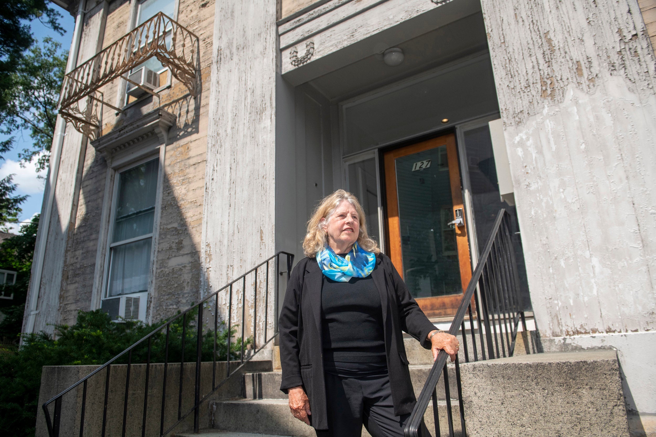 Professor Suzanne Preston Blier stands in front of the Harriet Jacobs house in Cambridge.