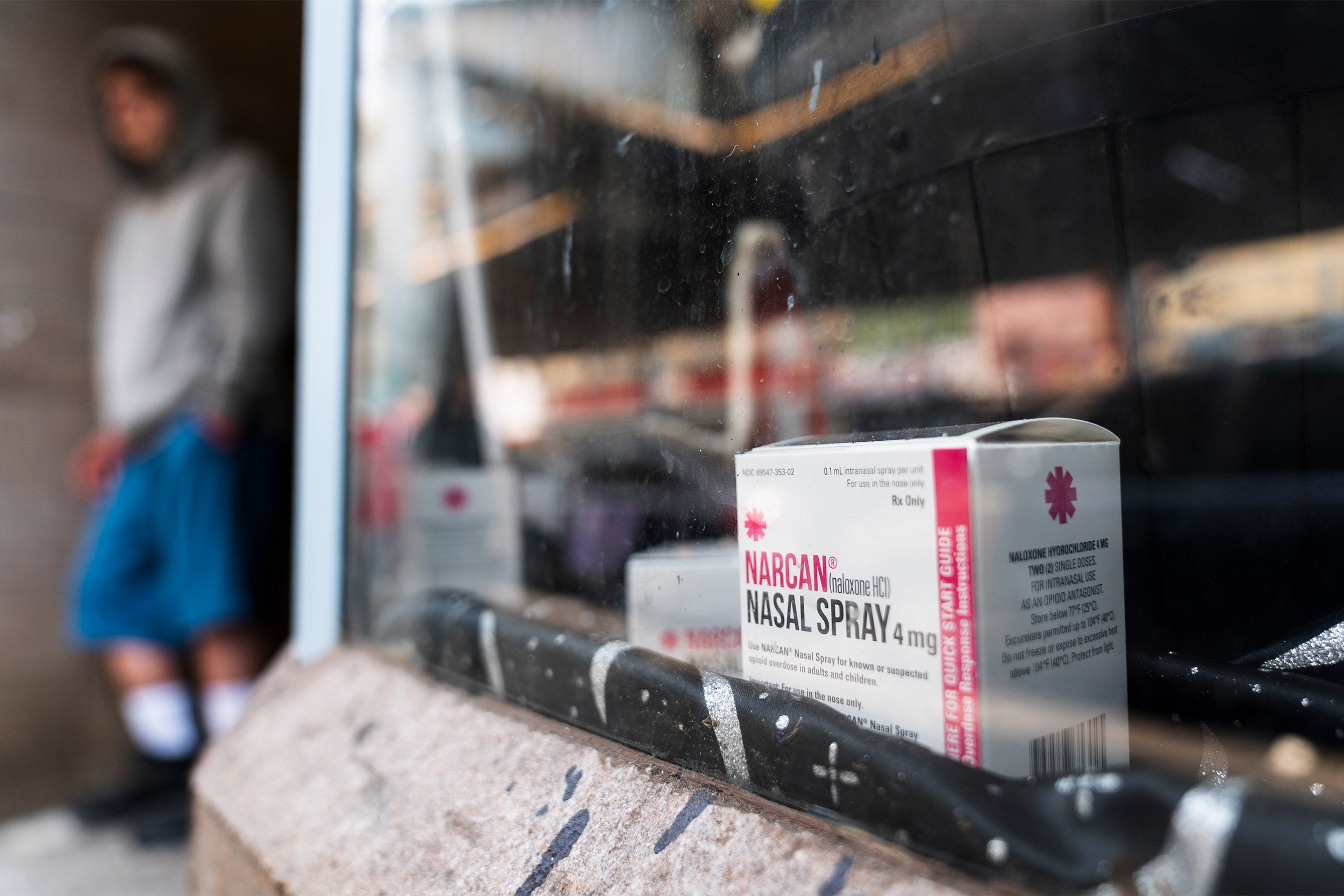 A box of Narcan sits on a shelf.