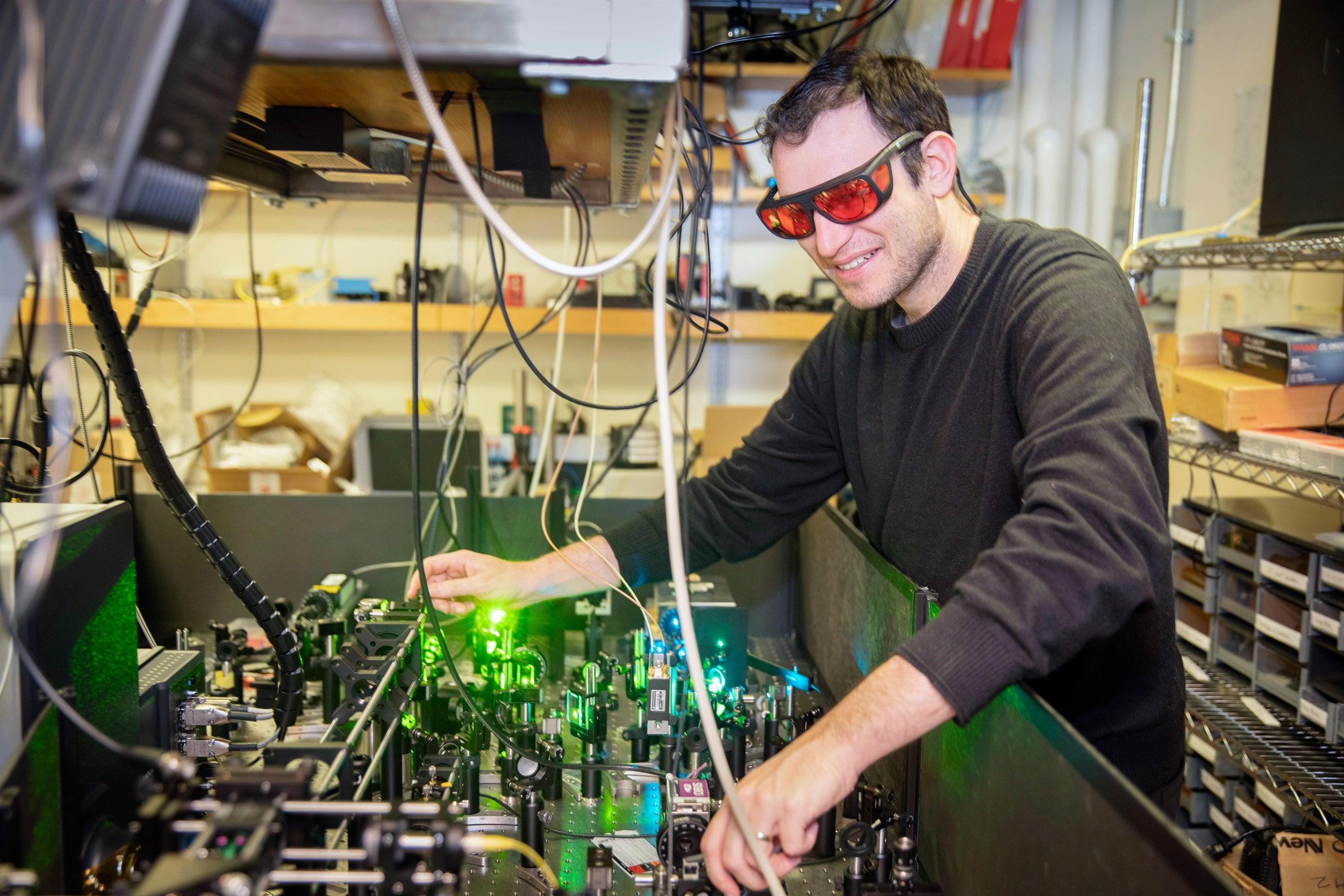 William Allen with lasers in the lab.