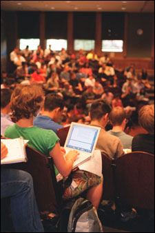 Student taking class notes on her laptop