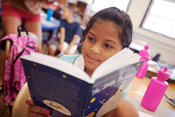 Alondra Ruiz chooses a passage from “The Little Prince” to perform. Students with the ELL program at the McKay School in East Boston studied the book this summer and interpreted passages using different artistic approaches.