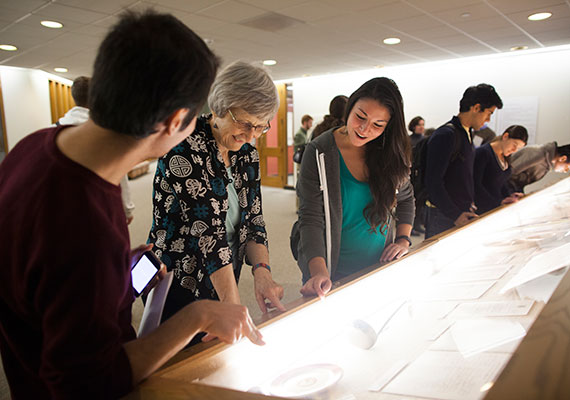 At the October opening of “Dining and Discontentment,” Professor Laurel Ulrich (center) talks with “Tangible Things” students Ozdemir Vayisoglu ’16 and Deborah Montes ’16.