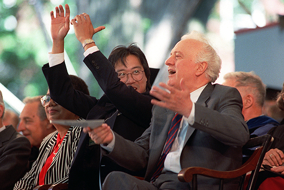 American cellist Yo-Yo Ma (left) shows Eduard Shevardnadze, former Soviet foreign minister, how to do the wave shortly before Commencement in 1991. The two honorary degree recipients react to the assembled graduates enjoying the festivities. Photo by Elise Amendola/AP Photo