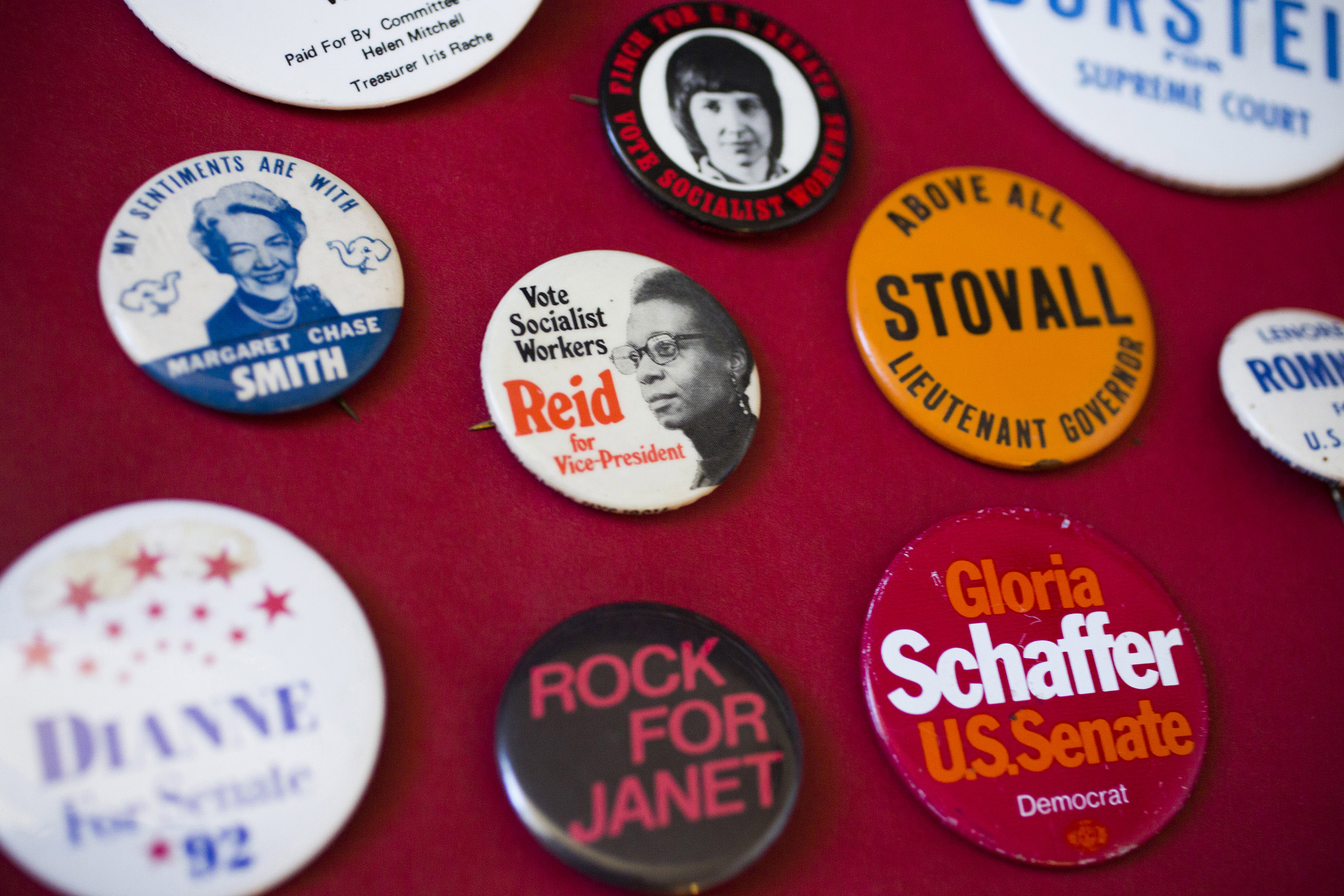 Buttons representing female candidates from conservative to socialist parties.
