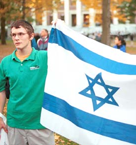 Protester carrying Israeli flag