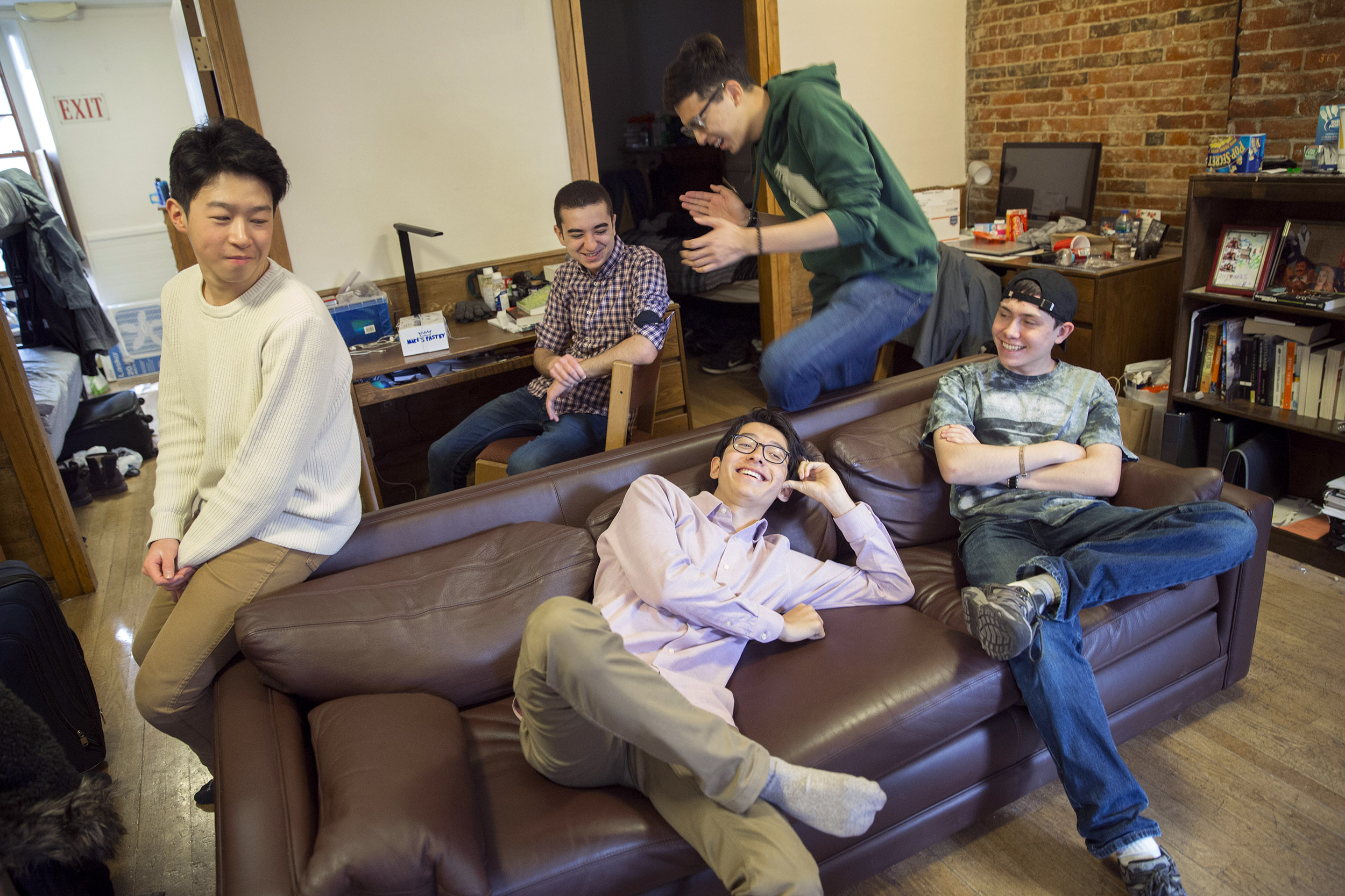 Roommates, Luke Xu, (from left to right) Abdelrhman "Abdul" Saleh (plaid shirt), Sung Ahn (green sweatshirt), Kenneth Shinozuka (wearing socks), and Clifford "Scotty" Courvoisier, All class of '20 live in Holworthy Hall together.