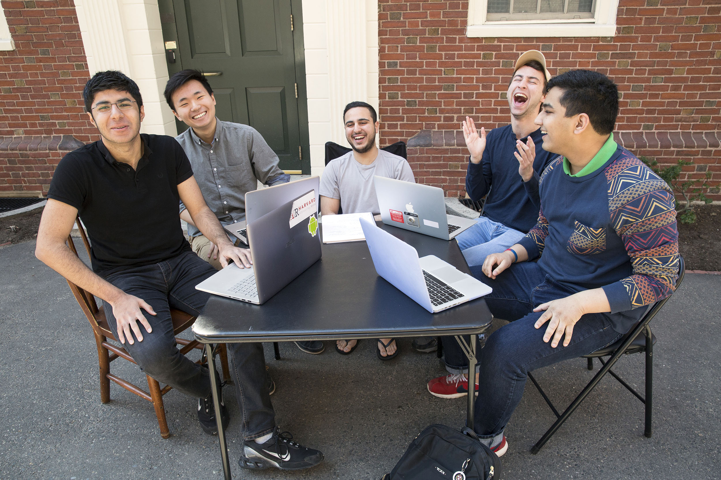Roommates in Wigglesworth sit outside their dorm on what they call their "porch": (l to r) Soheil Sadabadi '20 (Iran), Andrew Cho '20 (AZ), Michael Shadpour '20 (CA), Scott Kall '20 (MA), and Arpan Sarkar '20 (TN).