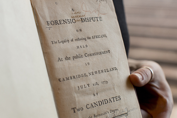 The Harvard University Archives contains a copy of the 1773 Philosophy Chamber debate between Harvard seniors Theodore Parsons and Eliphalet Pearson on whether slavery was compatible with “natural law.” Rose Lincoln/Harvard Staff Photographer