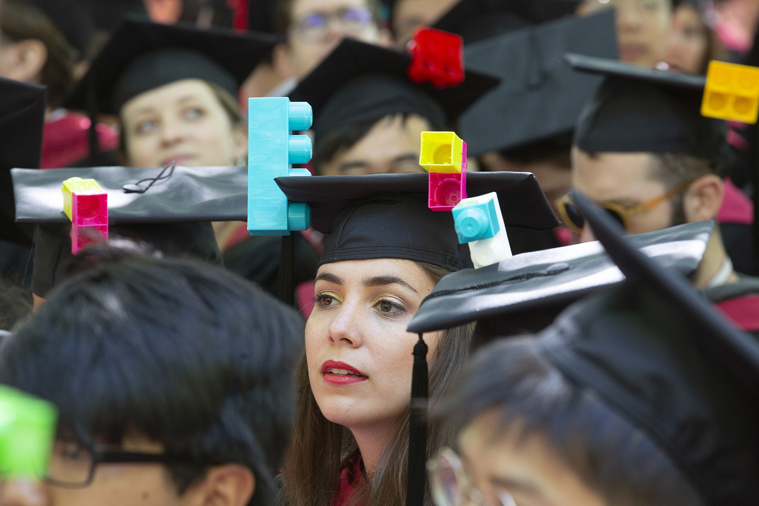 Graduate with Lego mortarboard.