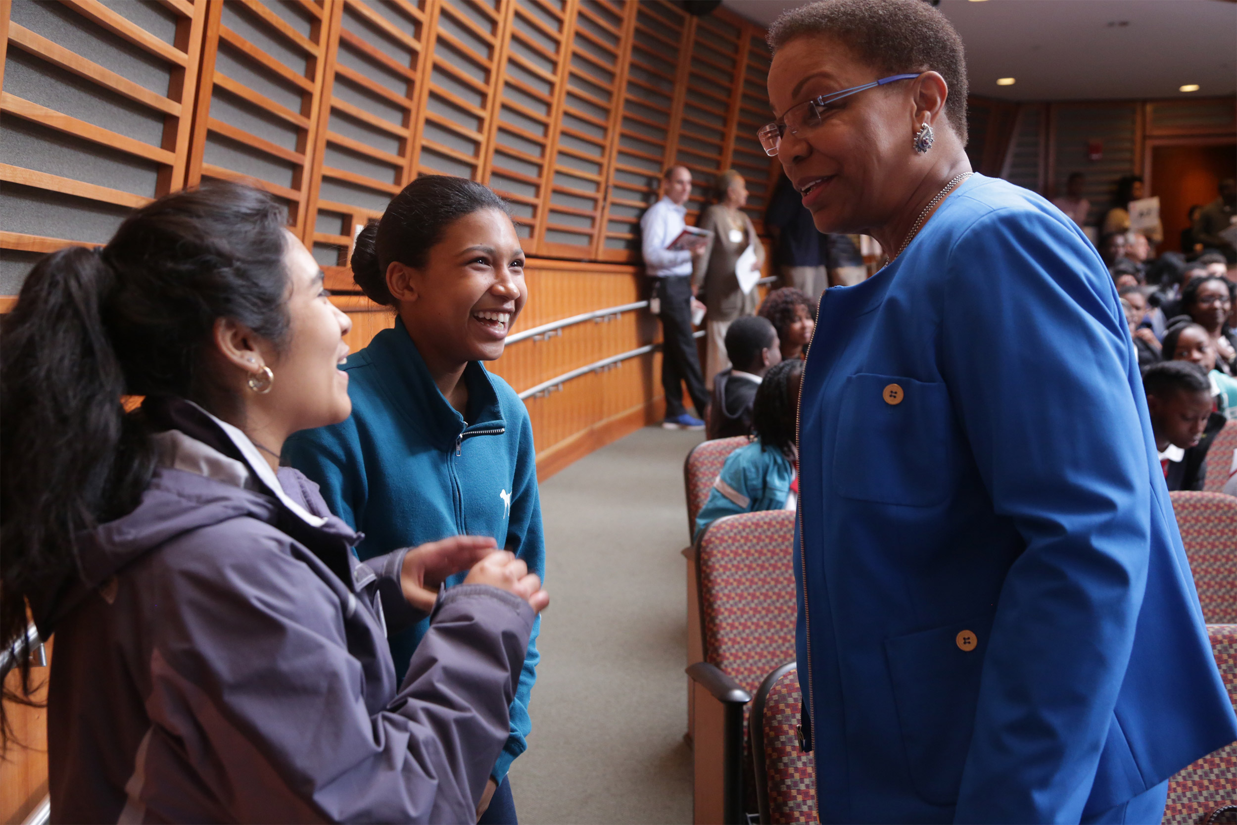 Joan Reede talking to young students.