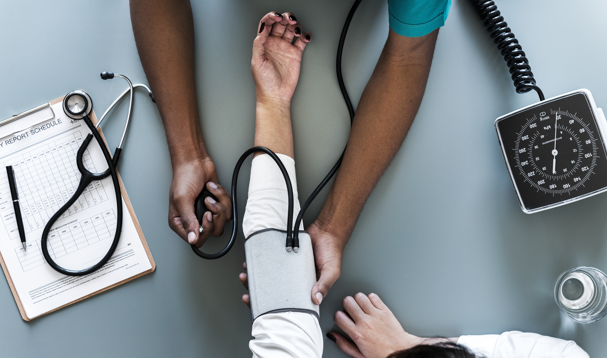 A person getting their blood pressure taken with a cuff