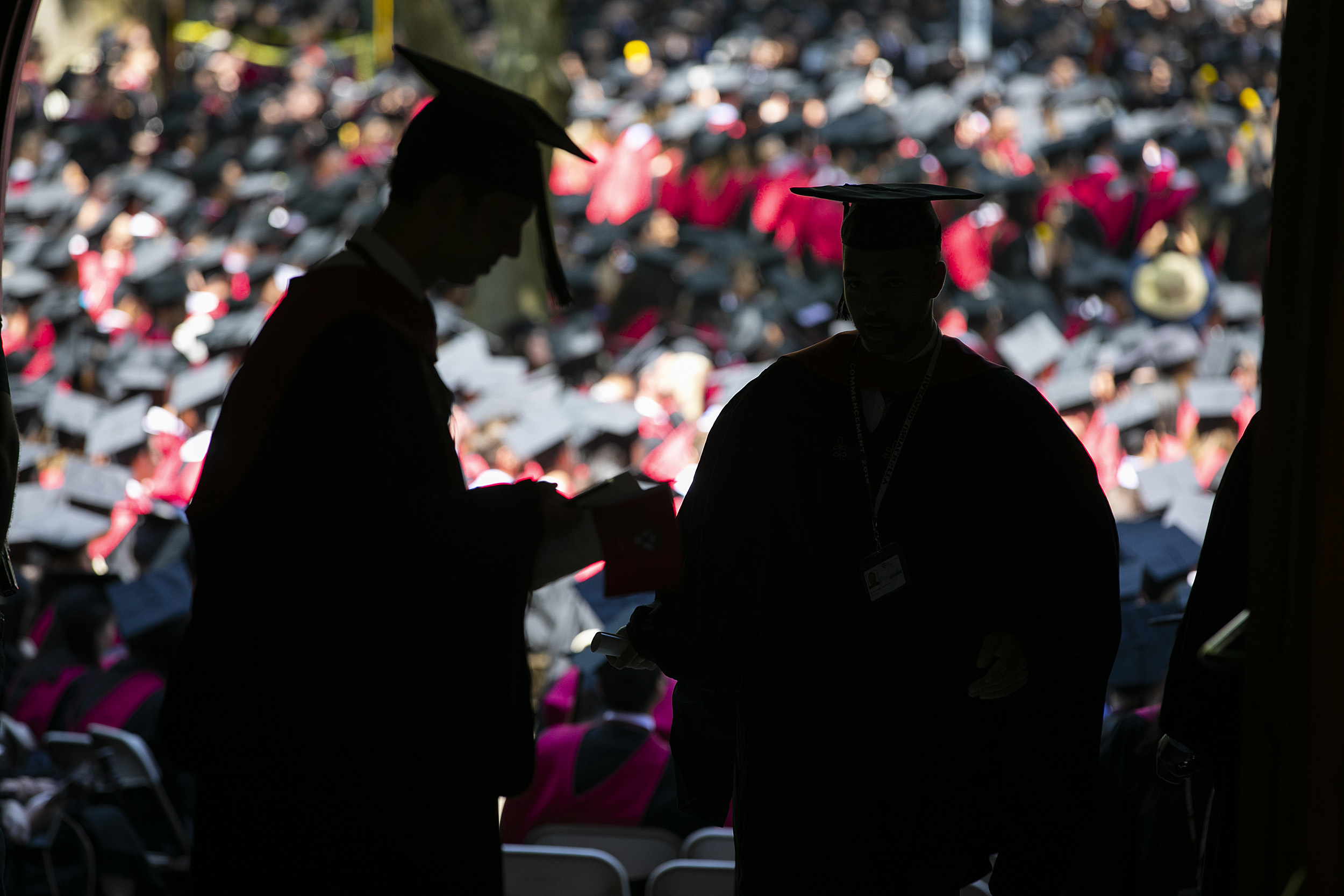 Graduates in silhouette.