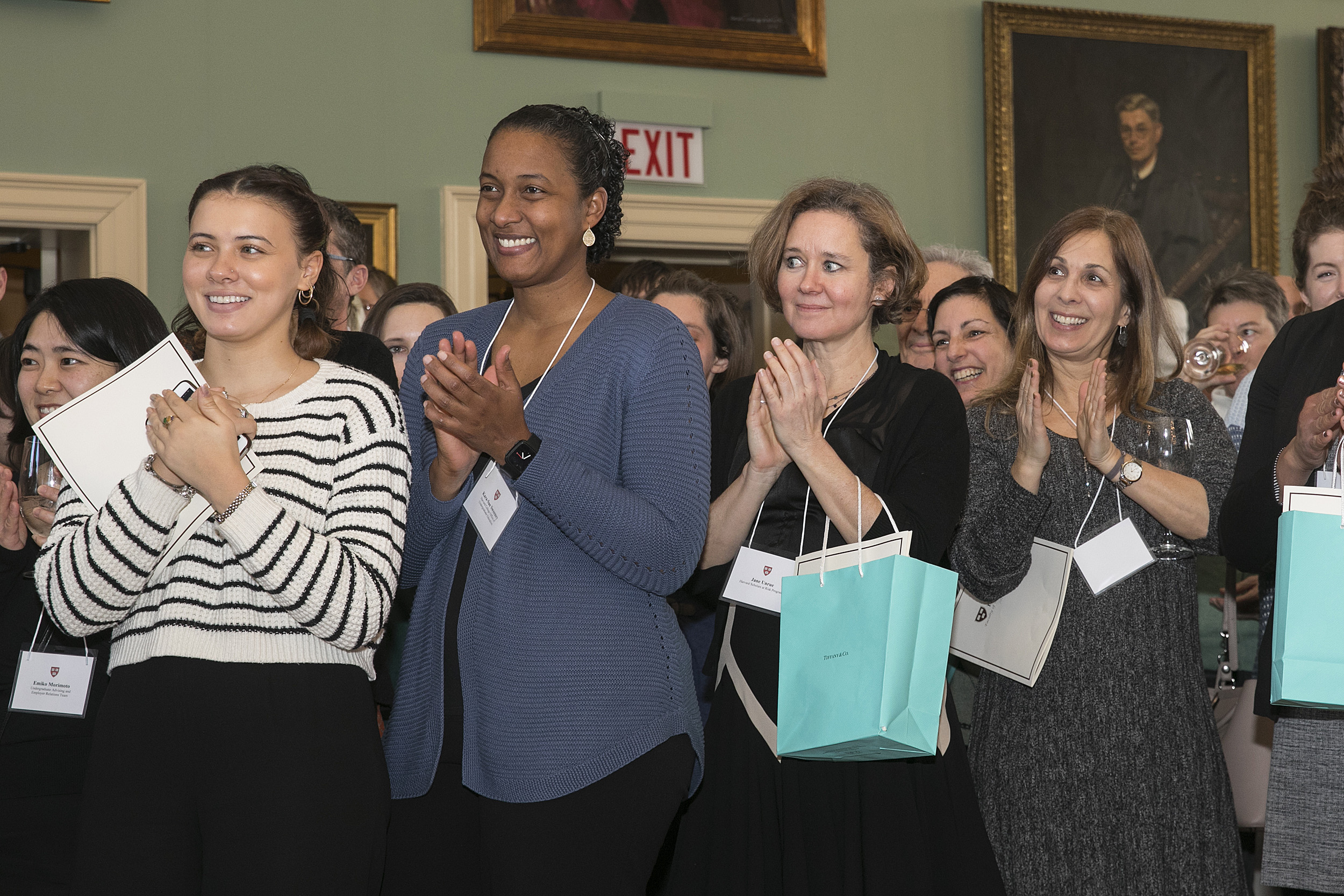 Four women applauding