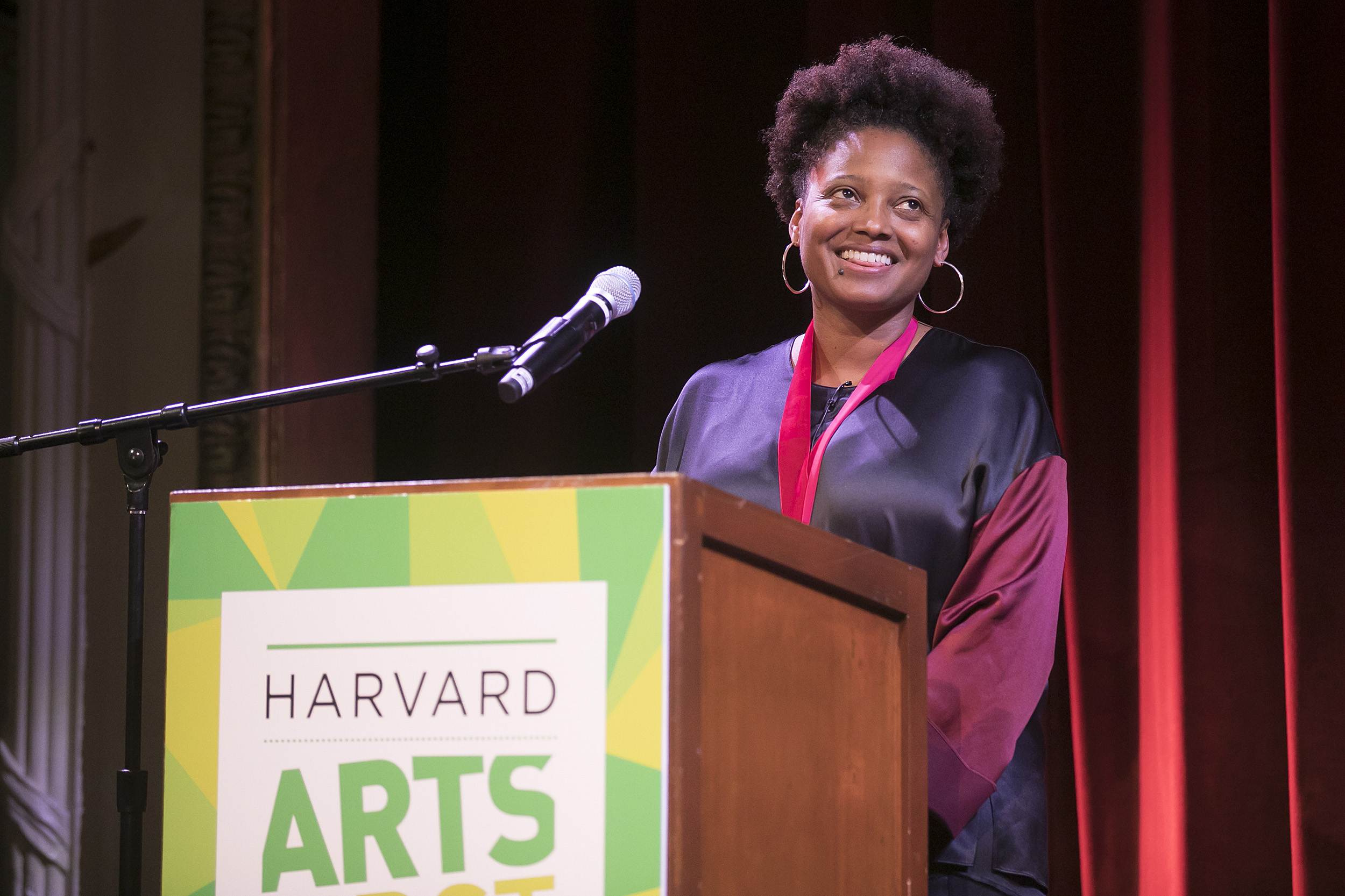 Tracy K. Smith smiles at the podium