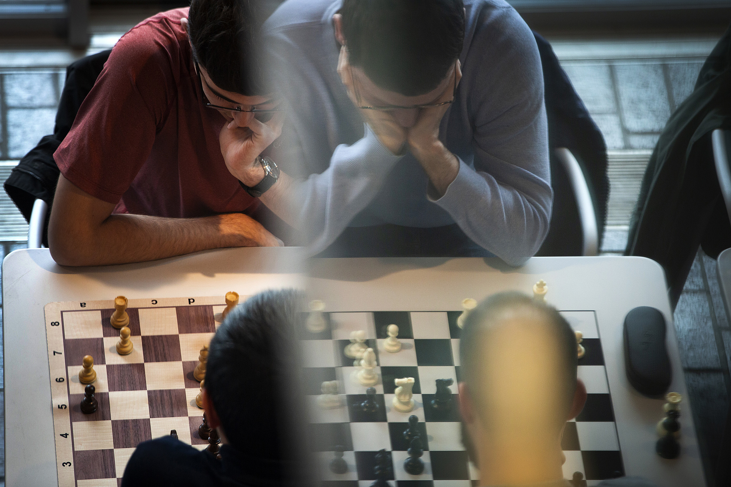 Chess players concentrate.