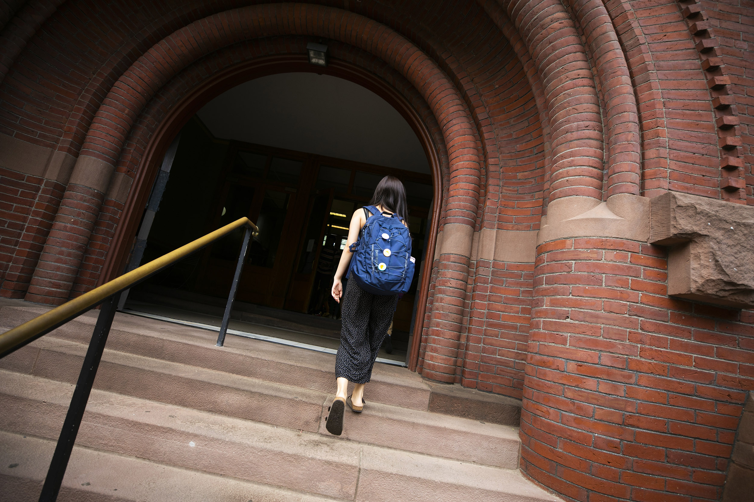 One student walks into Sever Hall.