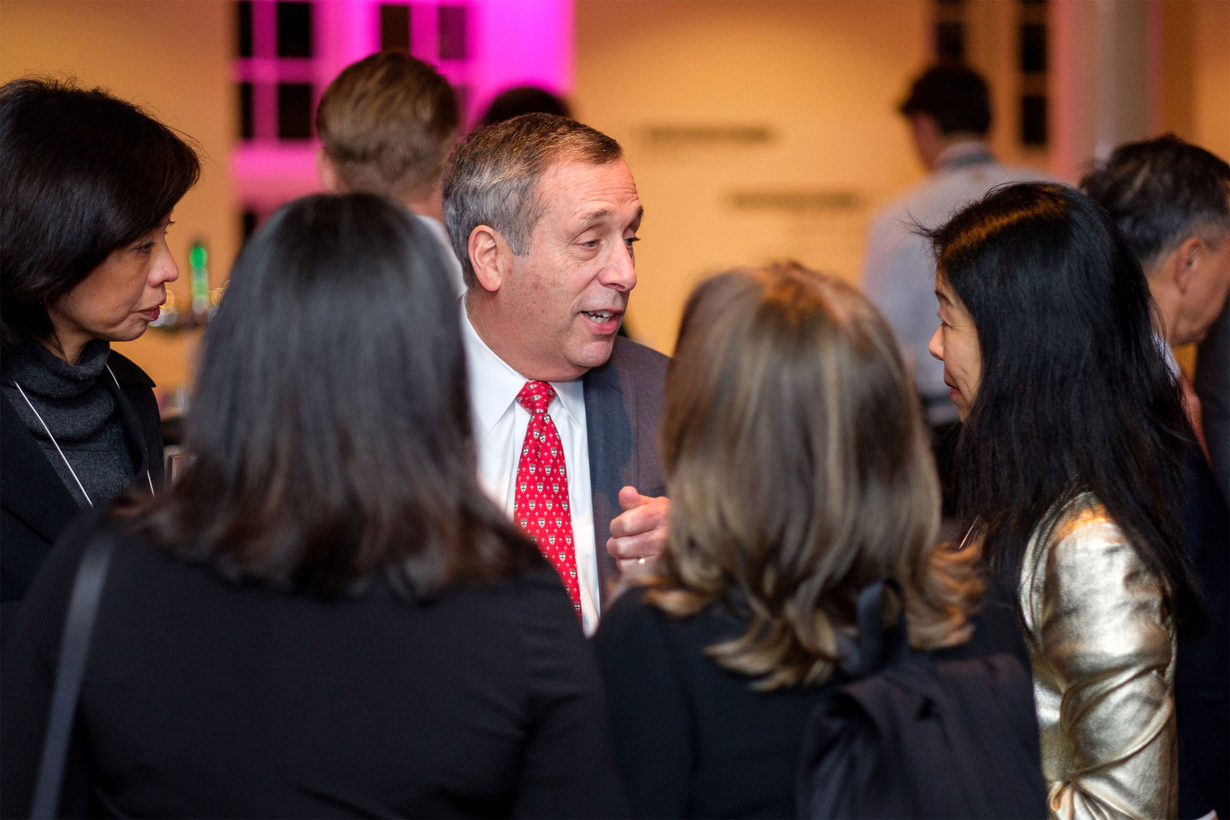 Larry Bacow speaking with conference-goers