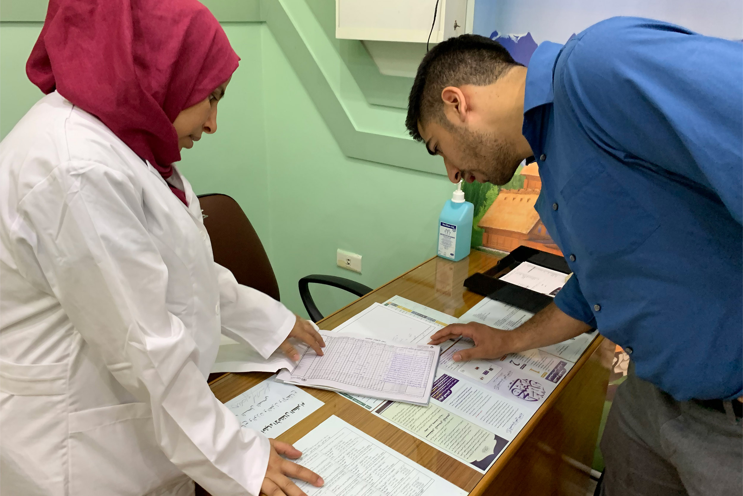 Inspecting medical documents in Tripoli.