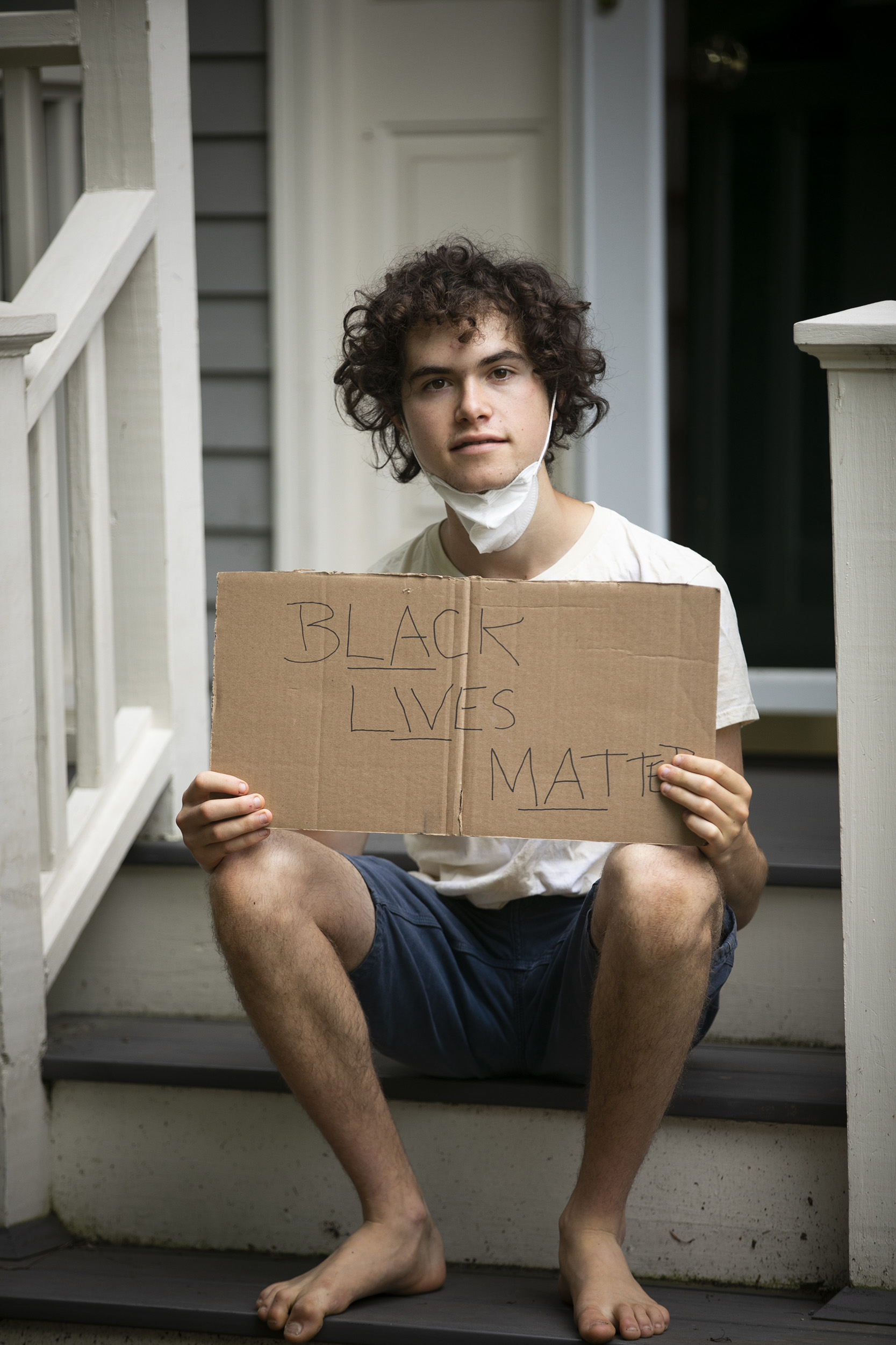 Jeremy Ornstein holds Black Lives Matter sign.