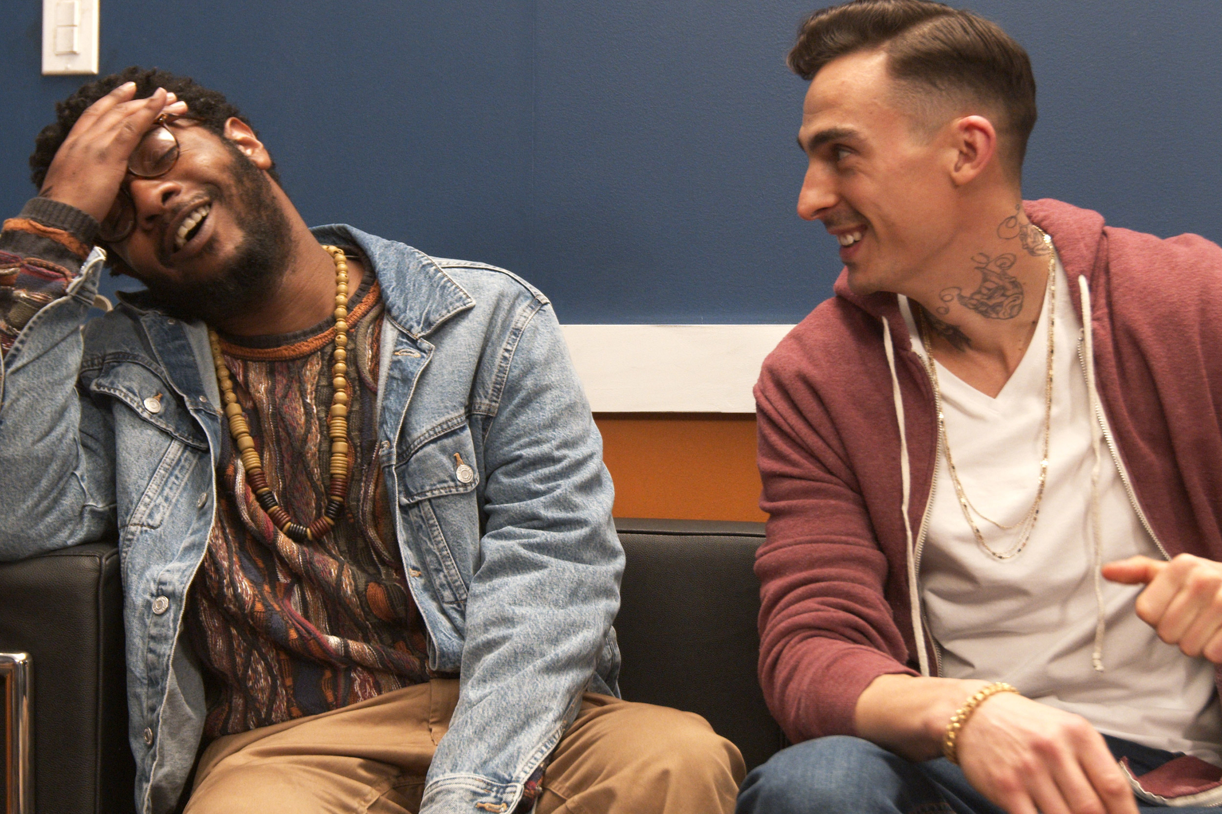 Kadahj Bennett (left) plays Verb, a Black hype man for white rapper Pinnacle, portrayed by Michael Knowlton.