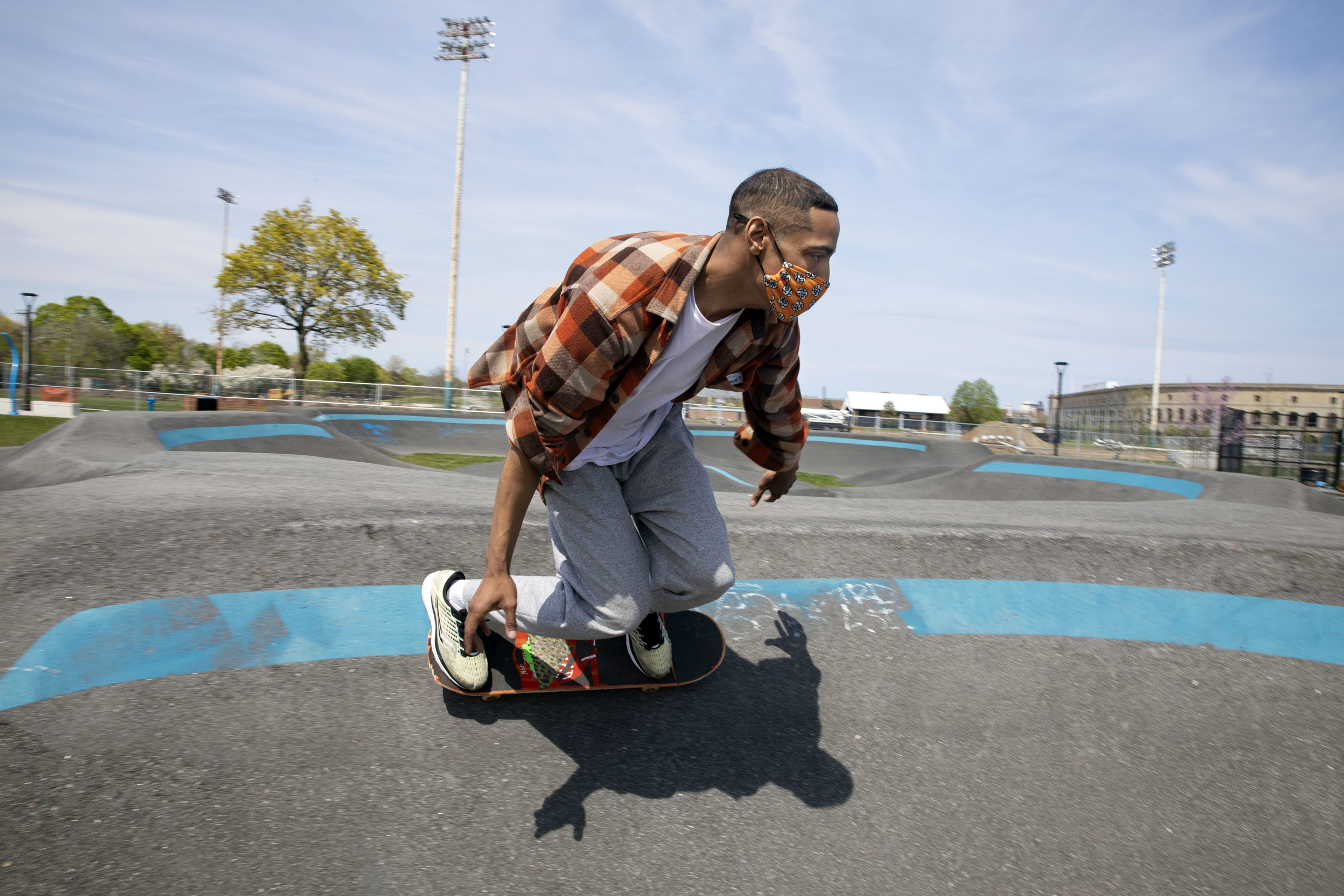 At the Smith Field in Allston, Will Newson, takes a relaxing ride around the pump track at the public skatepark.