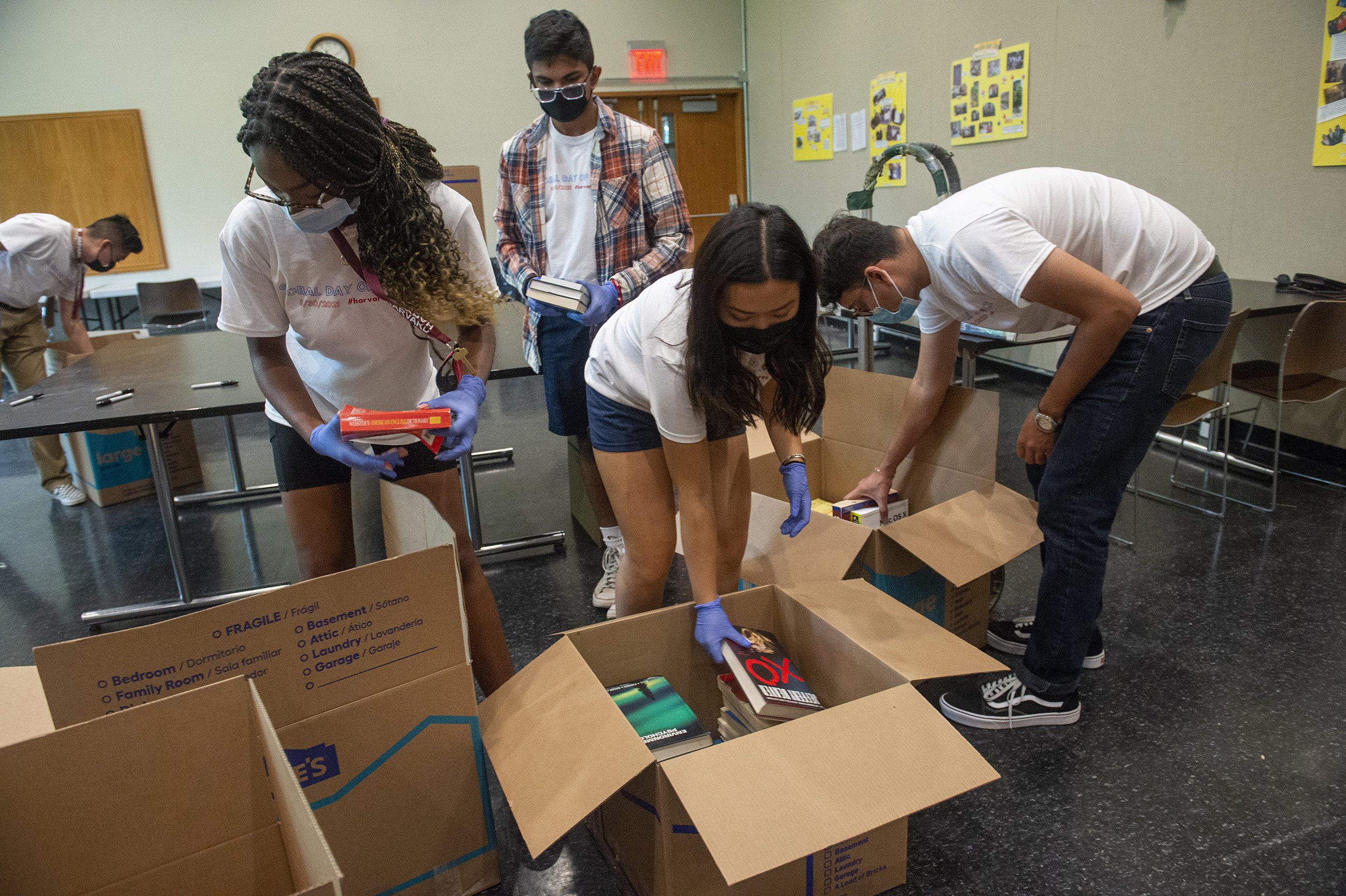 Students packing boxes.