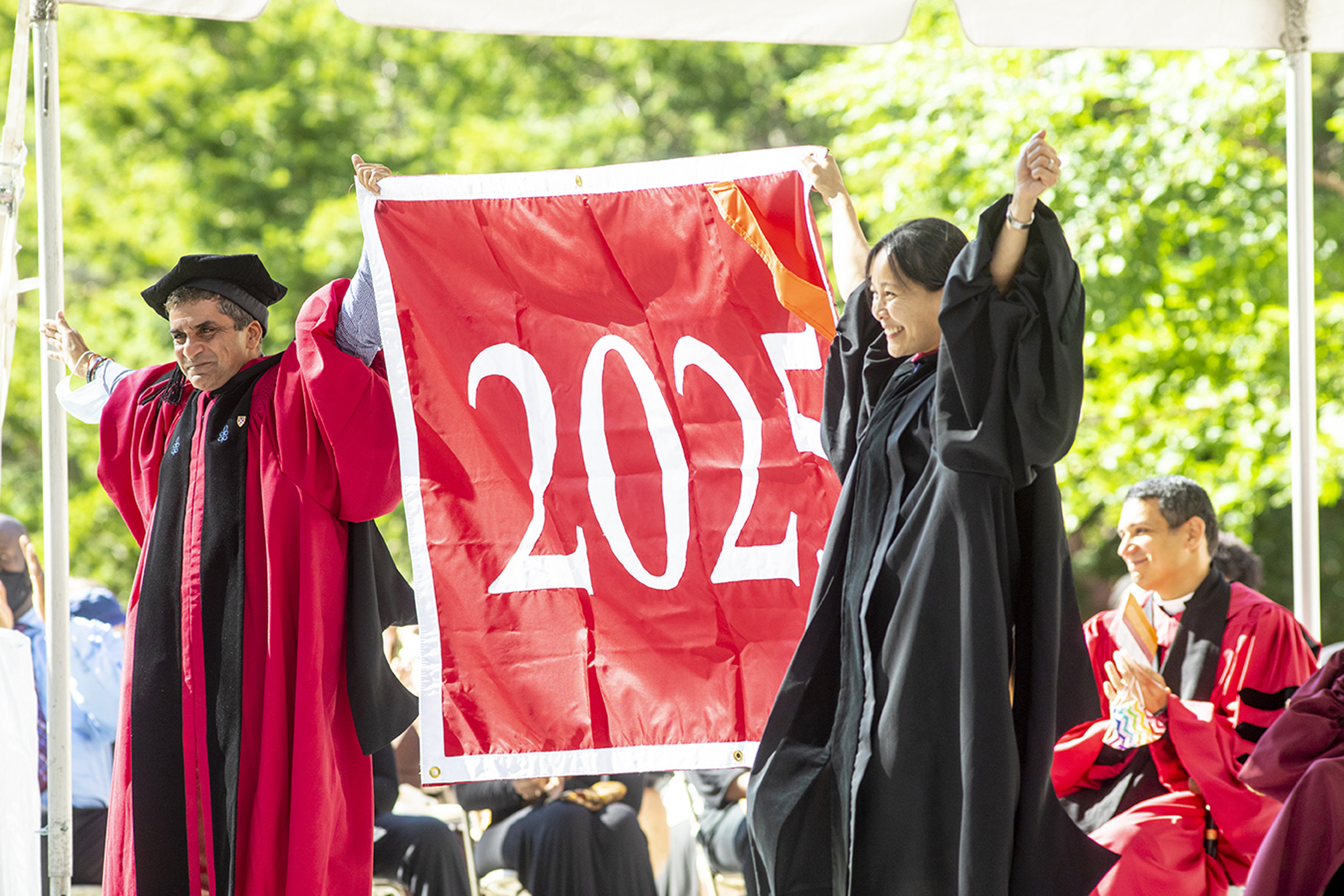 Danoff Dean of Harvard College Rakesh Khurana (left) and Vanessa Liu, president of theHarvard Alumni Association, give the Class of 2025 an enthusiastic welcome.