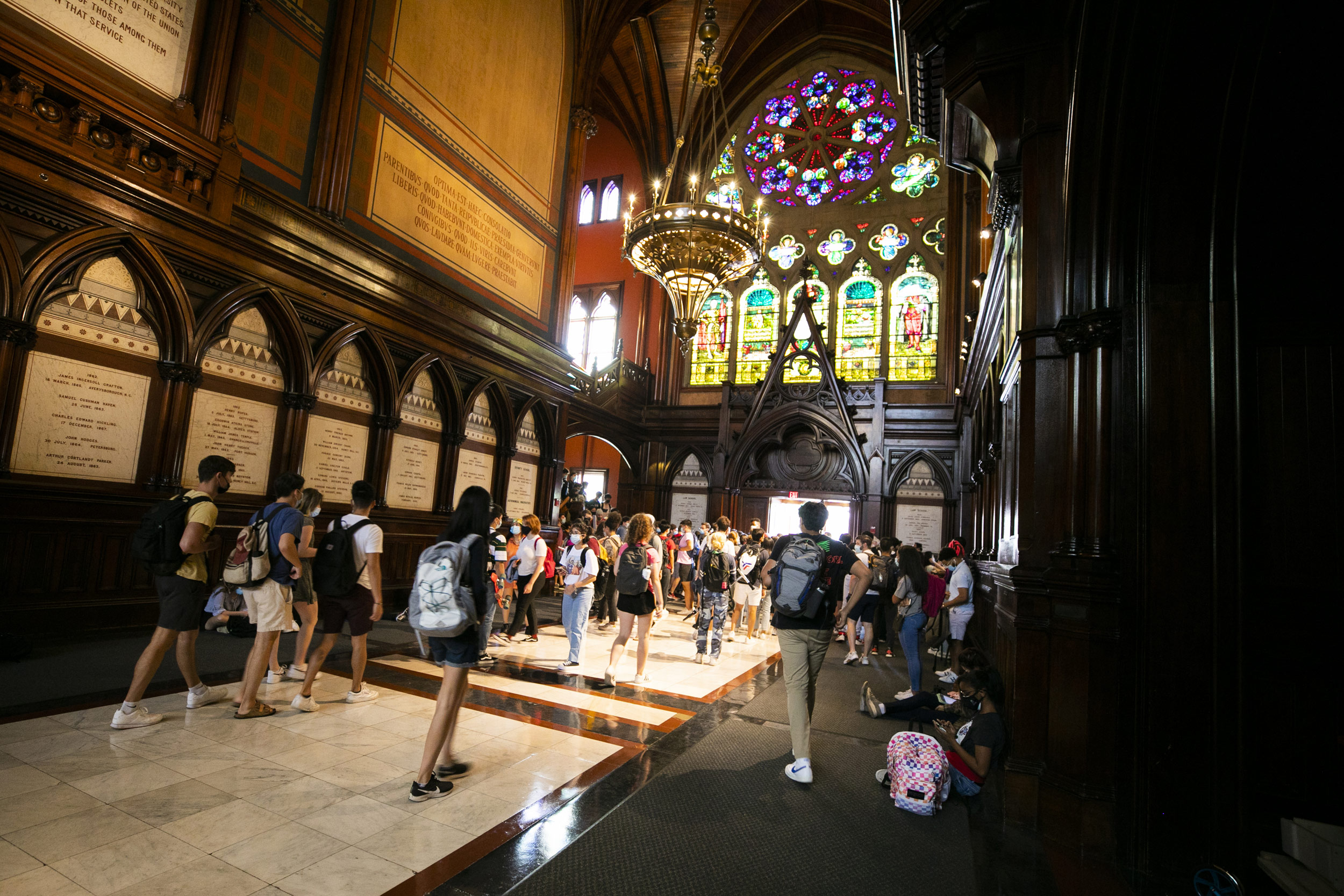 Students gather in the transept before heading into the lecture.